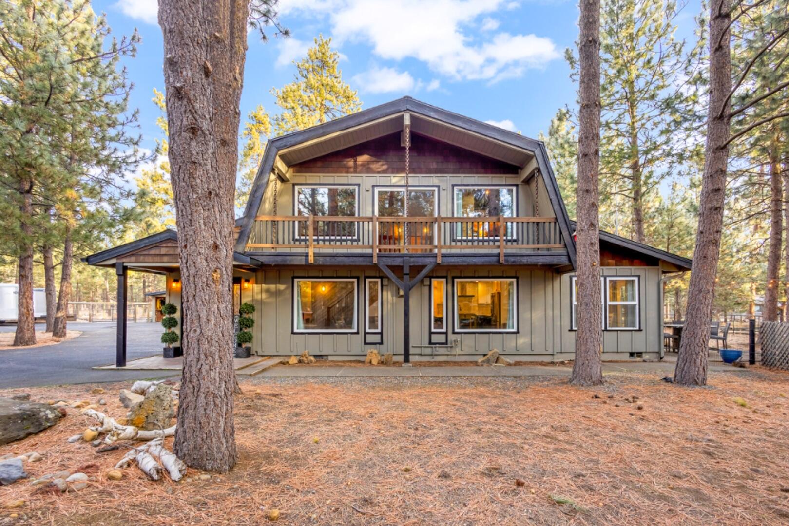 BRAND NEW exterior paint on all structures and most of interior repainted! Fully functioning, ready to go horse property with two-stall horse barn, two paddocks (able to open into 1 long run), round pen, hay storage, tack area and access to 1000's of acres of USFS land with miles and miles of riding trails. Home has two offices in addition to three bedrooms. Home features: Open floor plan, newer downstairs flooring, updated kitchen with large island, quartz countertops, stainless steel appliances, high vaulted ceilings with tongue and groove, plenty of windows and skylights providing natural light, oversized primary bedroom downstairs, mud room, laundry room & canning room. Property features: Large paved circular driveway with lots of parking, garage/covered parking for 2 vehicles plus additional workroom/storage room, three year old roofs on barn/garage and six years on home, new HVAC system with high end filter, kennel and fenced yard for dogs, Pine treed lot minutes from Sisters.
