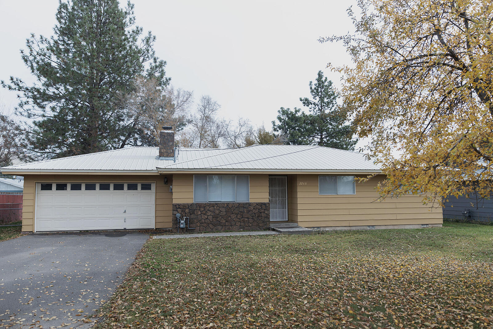This inviting 3-bedroom, 2-bath home offers comfort and peace on a quiet dead-end street. Inside, you'll find fresh interior paint, new flooring, a new water heater, new mini blinds, a new garbage disposal, and a welcoming living room with a cozy fireplace. The durable metal roof is built to last, and the exterior has been freshly touched up with paint. Outside, the fully fenced and good-sized yard provides plenty of space to relax, garden, let pets roam safely or for RV parking.  You won't want to miss this one-make your appointment to see it today!