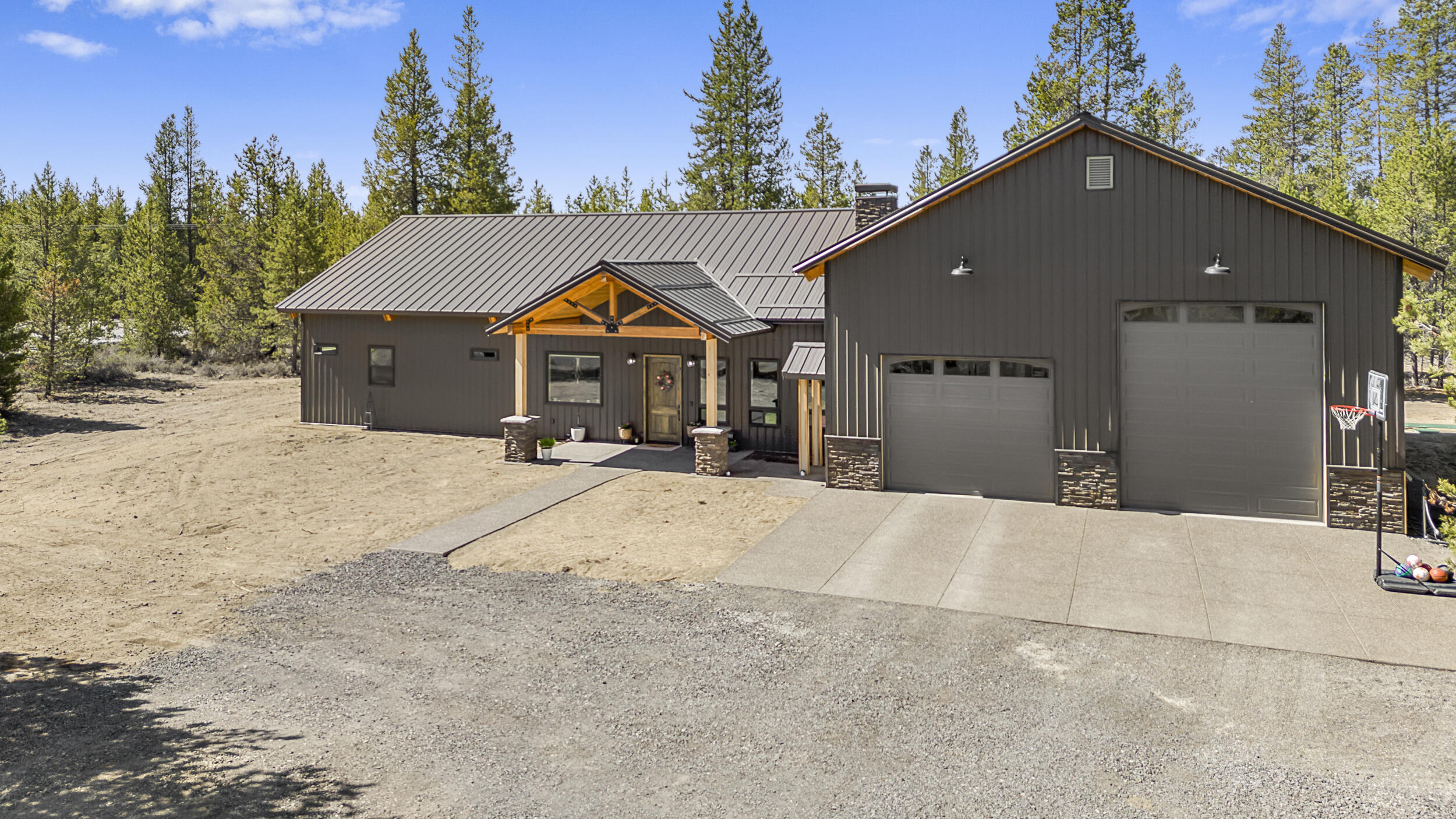 Extraordinary fully custom home on 1.24 acres near ORV trails with easy access to lakes! Enter the home to find an open concept living space with a 14 foot vaulted ceiling and 10 foot ceilings throughout the rest of the house to bring a light and bright setting. Meticulous attention to detail throughout. Optimal floorplan for function every day living and perfect flow from indoor to outdoor spaces for entertaining. Complete with a 1,608 sqft. fully finished garage/shop space with a 14 foot garage door opening for easy RV access.