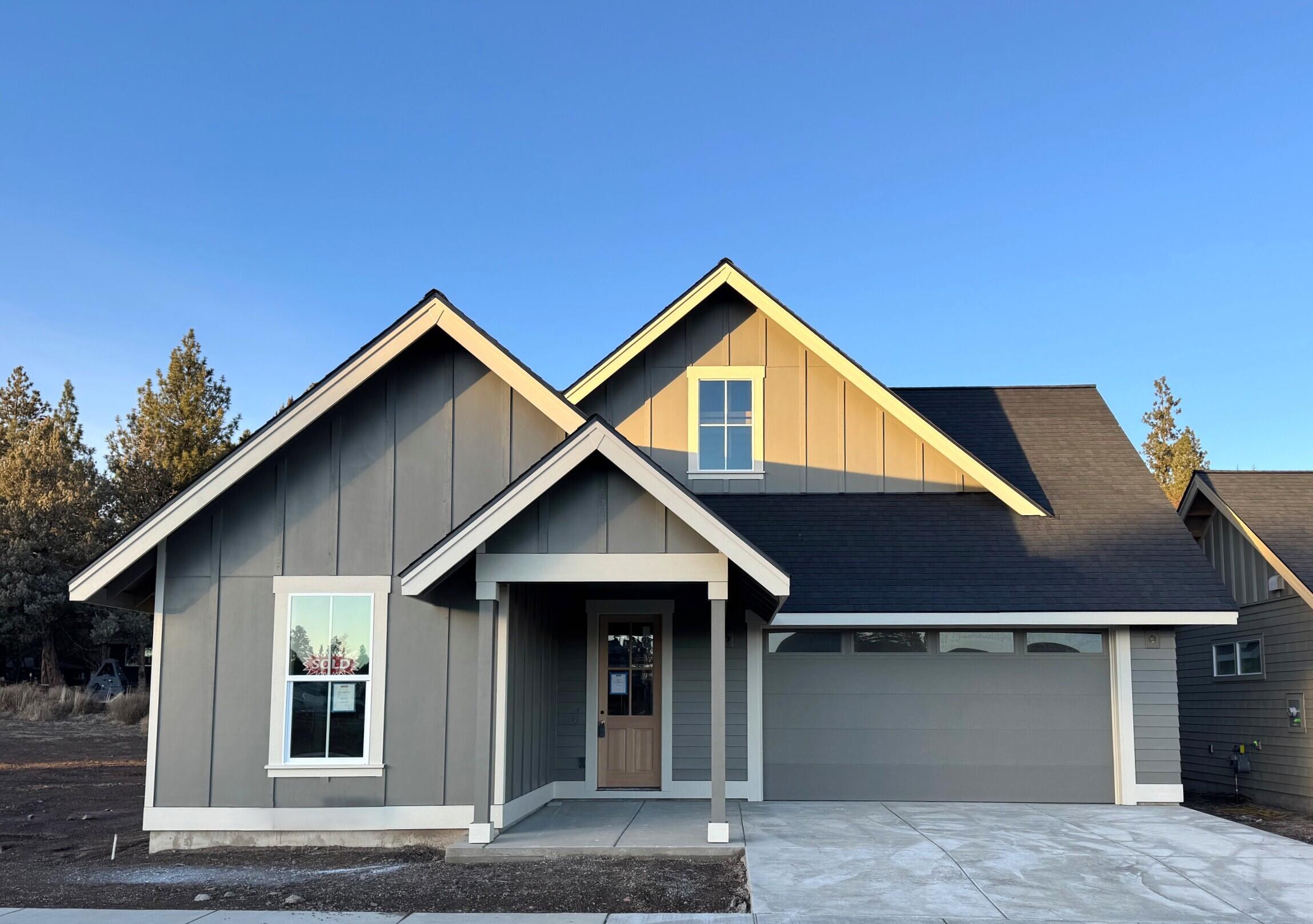 This beautiful single-level home combines style, colors, and thoughtful upgrades, including full yard landscaping and cedar fencing. Inside you'll find a light & bright open layout featuring a spacious kitchen and dining area that flows into the great room with its modern gas fireplace. The kitchen shines with solid surface counters, quartz island, tile backsplash, and stainless steel appliances. The primary suite offers a dual vanity, tile shower, and walk-in closet. Two additional bedrooms, a full bath, and a utility/mud room provide flexible space for family, guests or workspace. Enjoy durable, modern laminate flooring throughout the main living areas, bathrooms, and utility room. Step through sliding doors from the great room to a patio, ideal for outdoor living. With a ductless heating and cooling system, this home ensures year-round comfort and energy efficiency. No HOA fees!