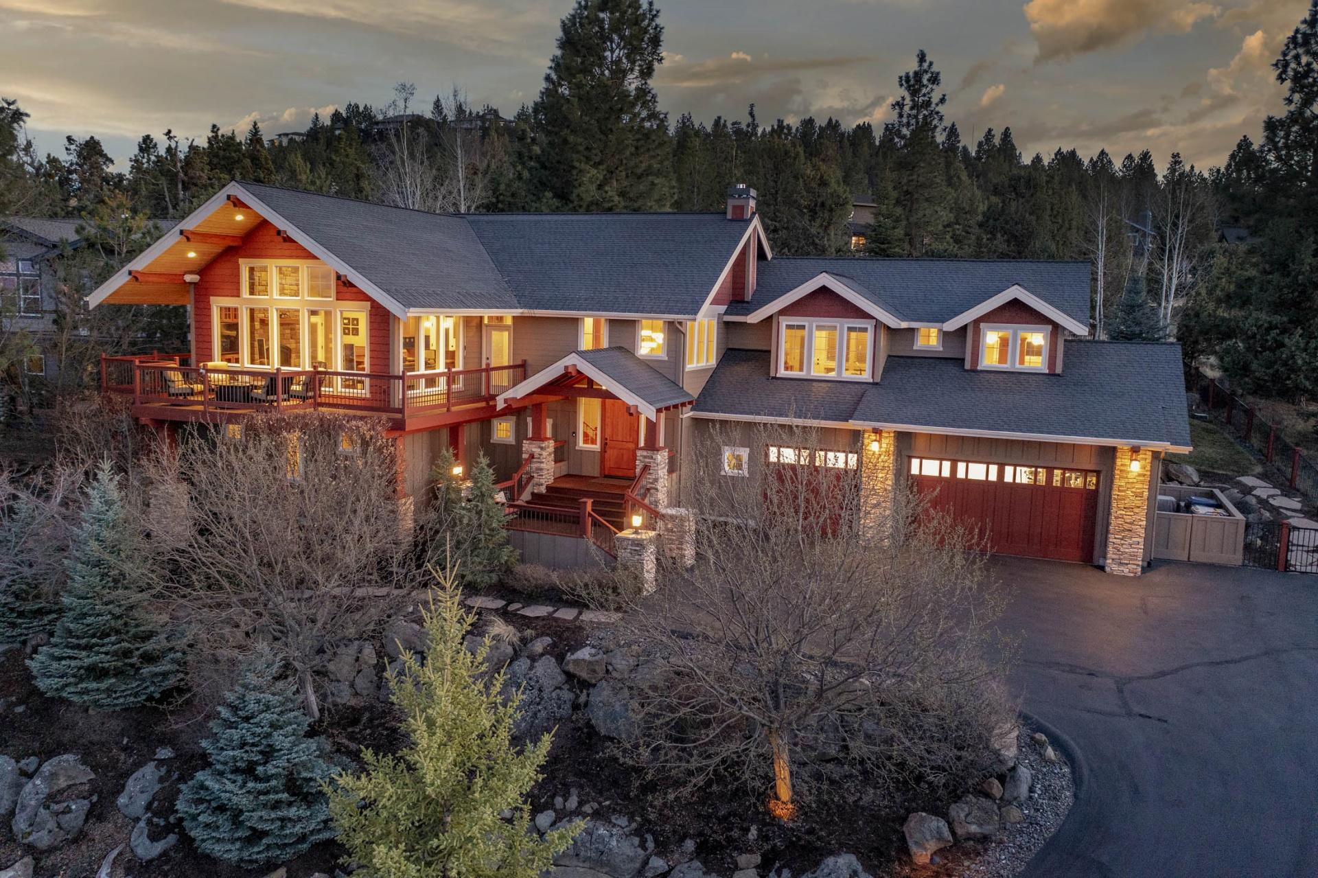 This incredible home on Awbrey Butte lives up to its street name, boasting truly remarkable views of the Cascade Mountains & the valley below. A wraparound
deck along the front of the home invites sunrise coffees & evening cocktail hours as you take in the views. Inside, a vaulted great rm w/ soaring windows on all walls also enjoys the views. Entertain guests in the open kitchen, featuring Dacor 6-burner gas cooktop + dbl oven, Sub Zero fridge, & W/I pantry. Behind the kitchen, pass by a small office area, laundry room, & powder rm on your way to the owner's suite. Enjoy a gas FP, w/i closet w/ built-ins, and incredible bath w/
double shower & soaking tub. The owner's suite includes access to the fenced backyd w/ spa, water feature, & patio, which can also be accessed from the laundry rm & kitchen. Downstairs, an incredible media rm includes a wet bar. 3 bedrooms & 2 bathrooms are also downstairs. Other features include a 3-car garage w/ epoxy, heated drvwy, & many smart features.