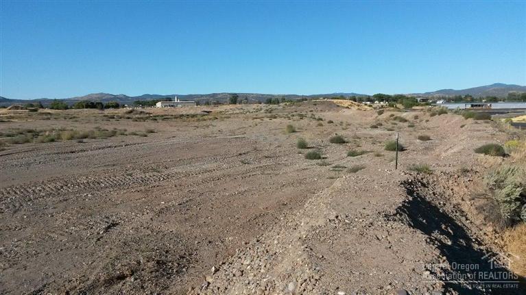 One of the few HM zoned properties available in Crook County. This 9.72 acre parcel has possible rail access and is located across the road from the City of Prineville's Railroad Depot. Just a few miles north of Prineville with great access to US Hwy 26. There is currently 1 acre of ground being leased out for storage, this brings in $500.00 per month, it is a month-to-month agreement. Property across Bus Evans Road also available. Maps and information available.