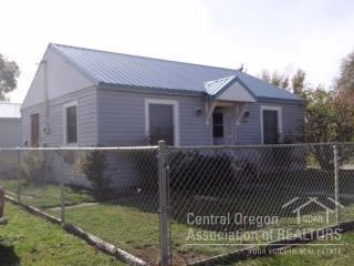 Great investment property. Good location in town. 2bed/1bath home. Metal roof on home and garage. Fenced yard.