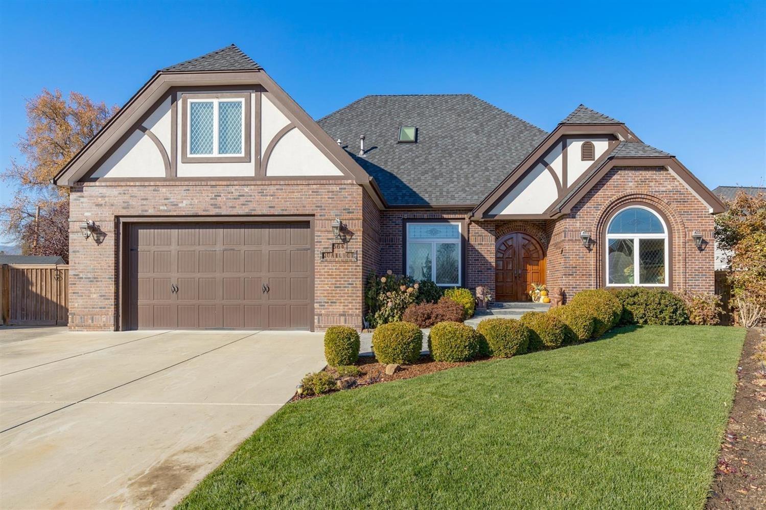 Absolutely stunning elegance from the moment you enter! Grand curved center stairwell is flanked by a salon and formal dining room (currently used as a hobby room). The great room has beautifully coffered and trimmed ceiling with recessed lighting. Granite kitchen with breakfast peninsula opens to the large informal eating area. Butler's pantry and walk-in pantry connect the kitchen and dining room. Main level master suite with jetted tub and killer walk-in closet that even has a corner shoe Lazy Susan! 2nd bedroom suite upstairs in addition to guest bedrooms & bath. Not an inch was spared when it comes to custom door trim ... even the attic access doors in the closets! Surround sound throughout, leaded glass transom windows over all windows and doorways. Large covered back patio accessed from the eating area and the master suite has 220 power. RV parking, beautiful landscaping & curb appeal, and at the end of a quiet cul-de-sac. Security equipment is owned but not active.