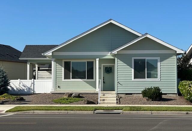 A beautiful quality built W.L. Moore Construction home built to Lifelong Housing standards and certified Platinum by Earth Advantage. Better than new, a single level home with an open and spacious floor plan, that is accessible and adaptable!. Charming deep front porch. Trayed Living Room with ceiling fan. Large dining area with single french door to side covered and uncovered patio. HUGE Kitchen with breakfast bar, under cabinet lighting, granite/quartz counters, pantry cabinet. Luxury vinyl plank thru-out all living areas. Utility room with extra cabinets. Master Bedroom with custom no-step tile flrd shower with seat, tile flrs, HUGE walk-in closet, and linen cabinet. Guest Bedroom with trayed ceilings, ceiling fan adjacent to guest full bath. Garage is over-sized and finished w/pull down stairs to storage. One of the largest lots for our 2 bedroom cottages in Twin Creeks!