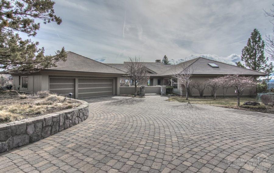 Stunning single level home has Panoramic unobstructed views from Mt Bachelor to the city lights of Bend, on a private one+ acre home site close to downtown. This rare and very desirable home has a timeless design by Steve Van Sant, and quality construction by Rick Francis. Open floor plan with large deck for entertaining and low maintenance landscape. Custom features include 2 Camas basalt stone fireplaces, tile roof, clear cedar siding, filled with built ins, sound system and enclosed entry garden.