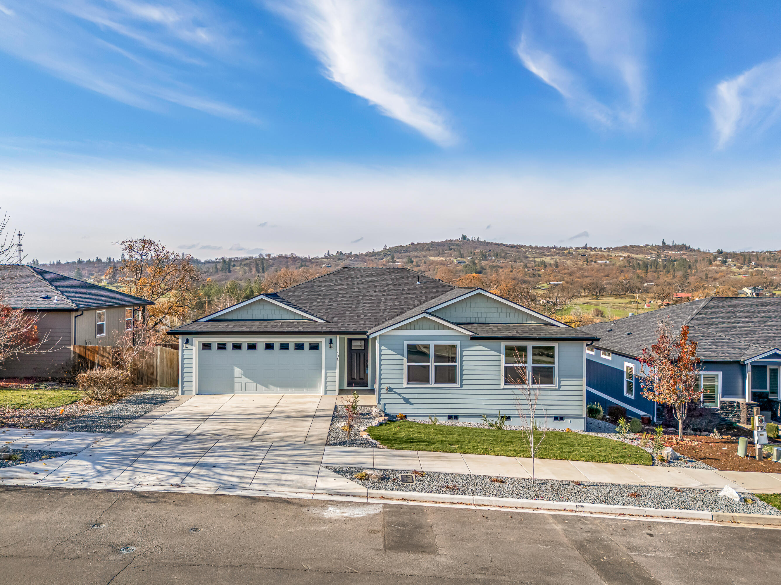 Brand new 2025 custom-built single level home with breathtaking views and a prime Eagle Point location. Snyder Creek Development presents this newly completed home filled with upgrades. The open floor plan showcases vaulted ceilings and panoramic views from nearly every room. Enjoy two spacious view decks off both sides of the living room and the primary suite. Features include an oversized finished 2-car garage, luxury vinyl plank flooring, upgraded fixtures, and custom soft-close cabinetry with granite counters. The kitchen offers stainless steel appliances, a walk-in pantry, and stunning views. The primary suite features dual sinks, granite counters, walk-in shower, and large walk-in closet. Energy-efficient ductless heating and cooling ensure comfort year-round. Outside boasts a landscaped front yard with sprinklers, fenced backyard, and two large decks for entertaining.