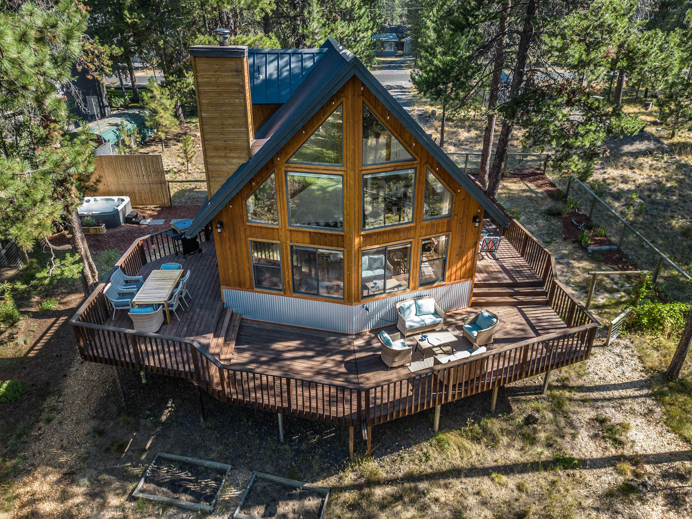 A rare opportunity to own a contemporary, turn-key, A-frame cabin right on a tributary connecting to the big Deschutes river! This established vacation rental has been tastefully renovated within the past year, and comes fully furnished with both inside and outside furniture, canoe/rowboat for enjoying the river, as well as a brand new hot-tub and grill. The home sits on a generously sized lot in the tranquil location of OWW and is your serene escape from the bustle of Bend. Designed with an open-concept layout, high ceilings, and large windows which allow ample amount of sunlight throughout the main living area, this is the ideal home for those seeking a blend of modern elegance nestled amongst the natural beauty of one of Bend's most desirable locations. Whether you're seeking your next investment opportunity, or looking for a peaceful retreat for yourself, the close proximity to Mt. Bachelor and ample nearby recreational opportunities make this home the perfect getaway.
