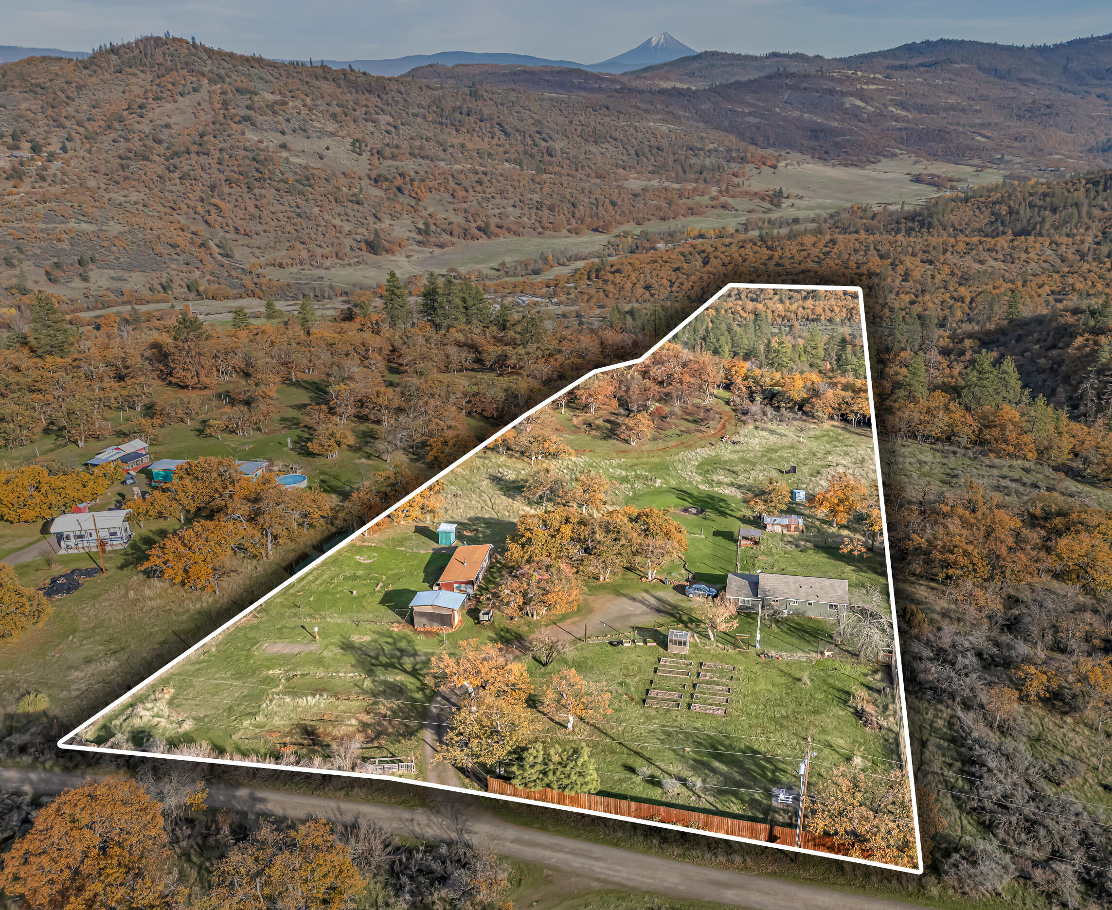 This starter homestead backs to over 200 acres of BLM land with a small but spacious 2-bedroom, 1 bathroom stick-built home. New features and updates include a new roof and gutters, paint inside and out, newly renovated porch/entry, and 3 new mini-splits. The large picture windows and vaulted ceilings make the home feel grand despite its petite size. Outside you'll find a generous garden area with deer fencing, fruit trees (pear, cherry, peach, almond and pomegranate!), and a quaint greenhouse. There's also plenty of space for a whole flock of birds and other small farm animals in the coop and small barn. Views of Mt McLoughlin complete this peaceful homestead retreat. Welcome Home!