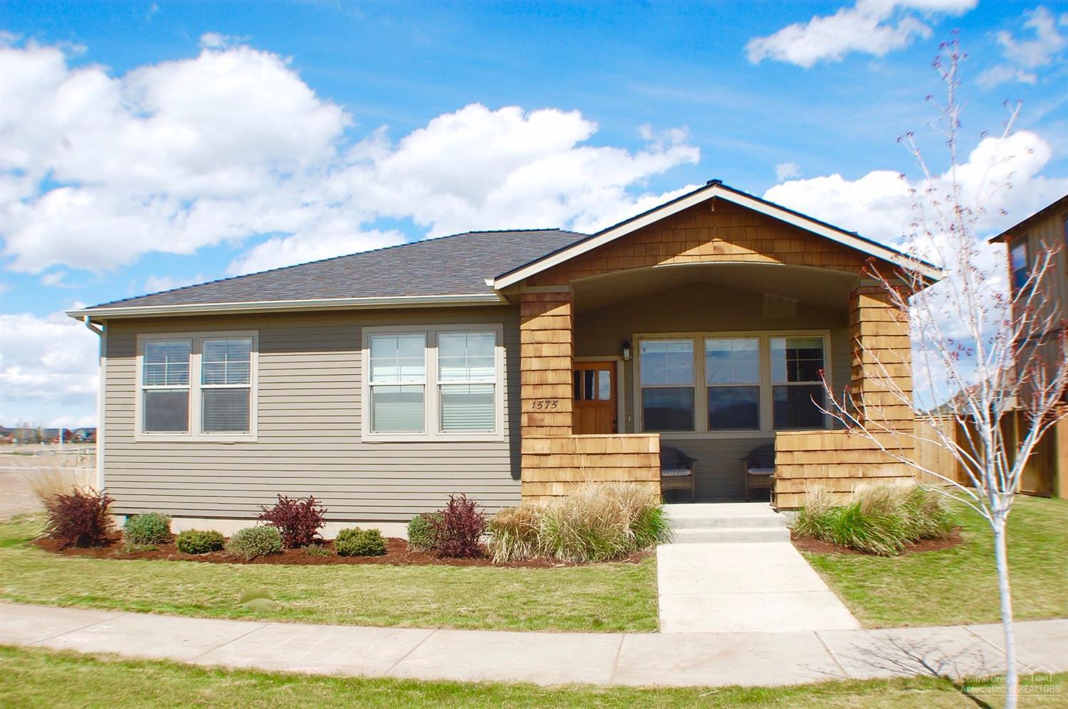 Practically new single level 3bd 2ba home in Ironhorse 1. Granite countertop, full tile backsplash, engineered floors, beautiful red brick gas fireplace, large lot. Home is certified Earth Advantage Energy efficient. Heat pump/gas forced air unit. Master has walk in close and 3/4 bathroom. Utility room off garage w/bench. Move in ready.