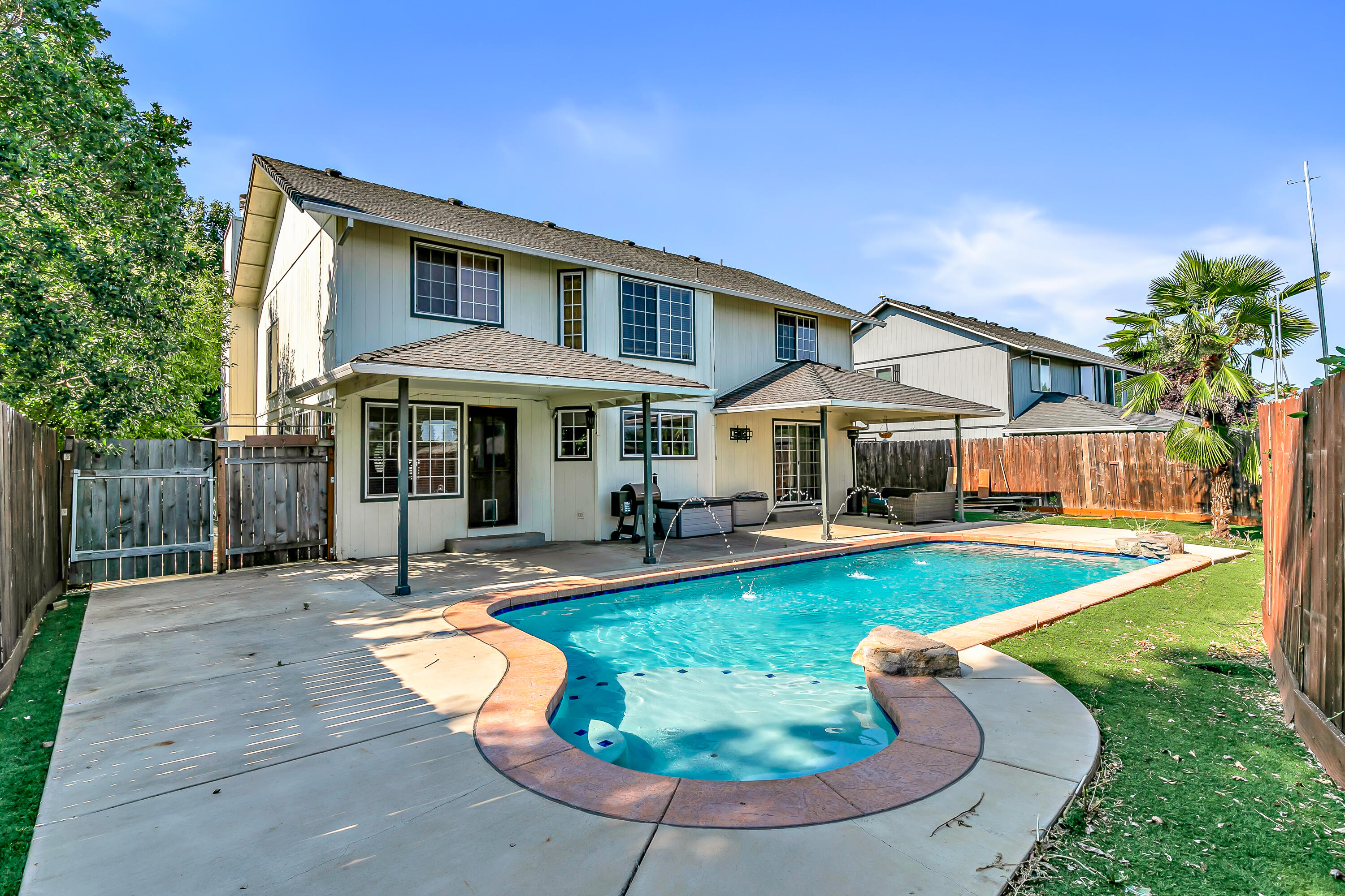 Tucked away on a private cul-de-sac, this 5-bed, 3-bath, 2-story home offers 2,544 sq ft of potential. Enjoy a spacious living room with vaulted ceilings, exposed wood beams, a river rock gas fireplace, and an open floor plan. The home features unique  dual primary suites—one on each level—plus a large loft upstairs. The backyard boasts a beautiful saltwater in-ground pool and low-maintenance turf, while the front yard is a blank canvas ready for your landscaping vision. Located in a desirable Central Point 
neighborhood, next to a park and close to schools, shopping, and dining. Features include small RV parking, newer HVAC system, an updated garage door, and a convenient laundry chute. This home needs some love and vision, but with a little sweat equity, it could truly shine!