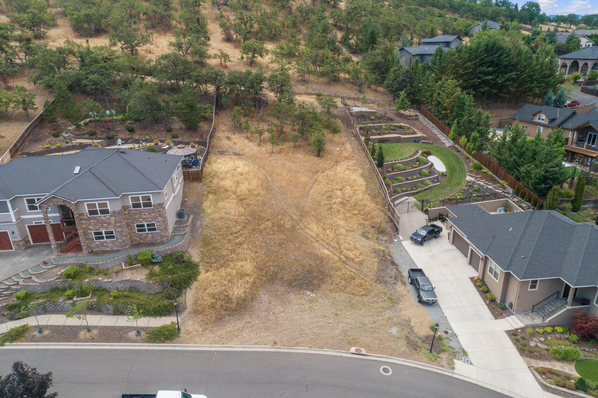 This large (.41 Acre) lot has breathtaking views of the Rogue valley and a front row seat to view Roxy Anne Peak. Surrounded by large, beautiful homes this lot is an incredible value! Seller is open to discussing owner financing options. CCR's have a 2,200 SQFT minimum house size.