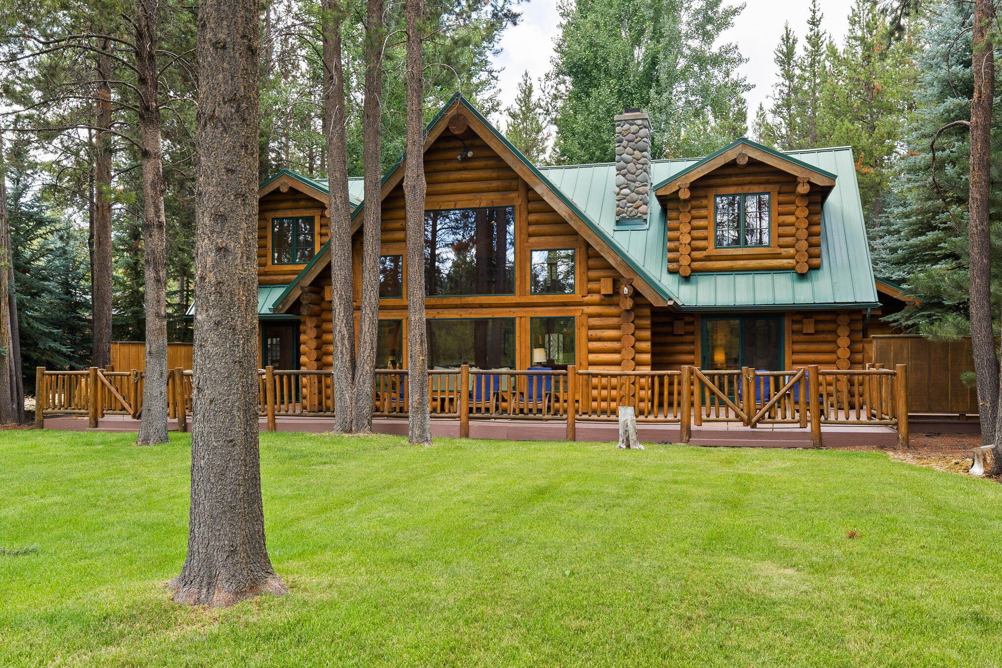 At the very end of a private, tree-lined drive, this fully furnished home is the last property along the river in River Meadows; delivering rare privacy, unobstructed water views, and exclusive access to community amenities like the pool, boat launch, dock(s), pickleball courts, and walking trails. Inside, it's the perfect blend of rustic charm and refined design, with vaulted wood ceilings, an open-concept layout, and curated finishes throughout. The spacious kitchen is made for entertaining, while the main-level primary suite offers ease and retreat. Upstairs, two guest bedrooms and a stylish loft boast panoramic river views; ideal for remote work, game night, or curling up with a good book. The expansive back deck is perfect for afternoon Happy's, sipping coffee, or watching the elk cross the river. Whether you're searching for a luxury vacation rental, a full-time home, or a weekend getaway, this turnkey riverfront cabin is everything you hoped for and more.
