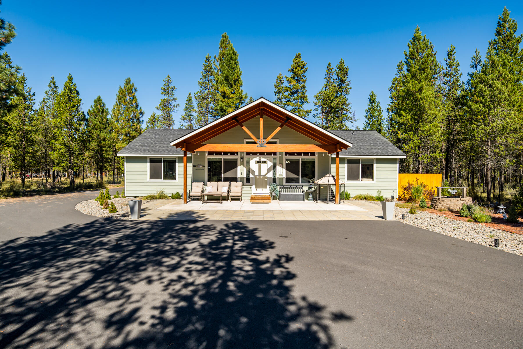 New price! Exceptional value in Three Rivers area. Welcome to your dream retreat in Central Oregon! Tucked into the peaceful and popular Three Rivers South community, this newly built 3 bed, 2 bath home blends privacy, comfort, and convenience. Set on a flat, tree lined half acre lot, and fully fenced backyard, you'll enjoy tranquil surroundings without feeling remote. Inside, vaulted ceilings and an open concept layout, create a bright, airy feel. The kitchen shines with granite countertops, stylish laminate flooring, and custom painted cabinetry - anchored by a bold gray island. The private primary suite features a luxurious en suite bath. Cozy up beside the wood burning stove on cool Central Oregon evenings, and enjoy the convenience of a paved driveway and low maintenance exterior. You're minutes from Mt. Bachelor, the Deschutes River, Fall River, and endless lakes and trails. Schedule your private showing today!