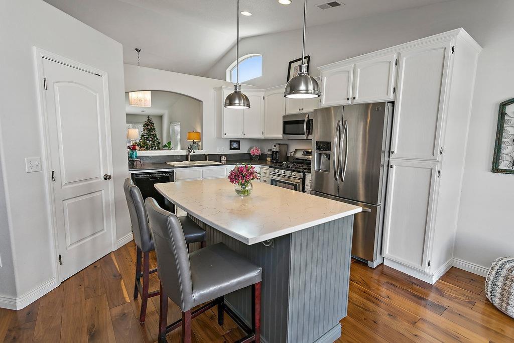 Welcome Home! This immaculately maintained home has many recent upgrades, and 13'x48' RV parking! This home features beautiful new Black Walnut hardwood flooring with custom baseboards, fresh interior paint, and updated light fixtures throughout. The kitchen is bright and modern with quartz counter-tops, large island, and all new appliances including a gas stove! Custom french doors lead from the dining room to a charming covered and extended patio, and a newly landscaped backyard. You're going to love this home!