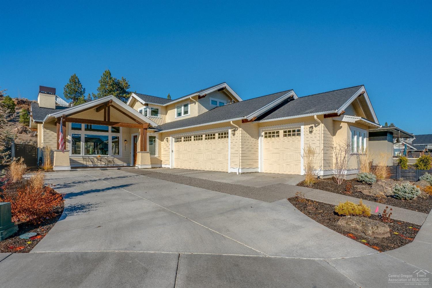 Highly desirable location in Bend's coveted Northwest Crossing neighborhood. Own one of the few fully custom homes on the cul de sac near Discovery Park. This home boasts an abundance of natural light and room for entertaining. Enjoy preparing meals in your gourmet kitchen with beautiful white cabinets, granite countertops, walk in pantry, and large center island. Wide plank wood floors throughout the home with heated tile in bathroom. Large master suite is on the main level and boasts a gorgeous soaking tub, walk in shower and sliding door to the hot tub area. The upstairs boasts 2 spacious bedrooms and a full bath. Back and side yards are fully landscaped and fenced so you can spend your weekends relaxing on your covered back patio. The oversized three car garage along with the large mud room give you plenty of extra storage space. Sliding barn doors, wood beams, power blinds, premium fixtures, and surround sound complete the luxury finishes of this Beautiful Home.