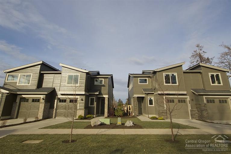 Welcome home to the all new sophisticated 8th Street Cottages community located in the heart of mid-town and the Orchard District. This easily accessible location supports the Bend lifestyle located only a half a block from Orchard Park, 1/2 mile to Hollinshead Park, 1.4 miles from the River & Pioneer Park. This high quality Pahlisch townhome features an over sized one-car garage, main level with great room & dining area, an upstairs with master suite, loft, hall bath, laundry and two more rooms.