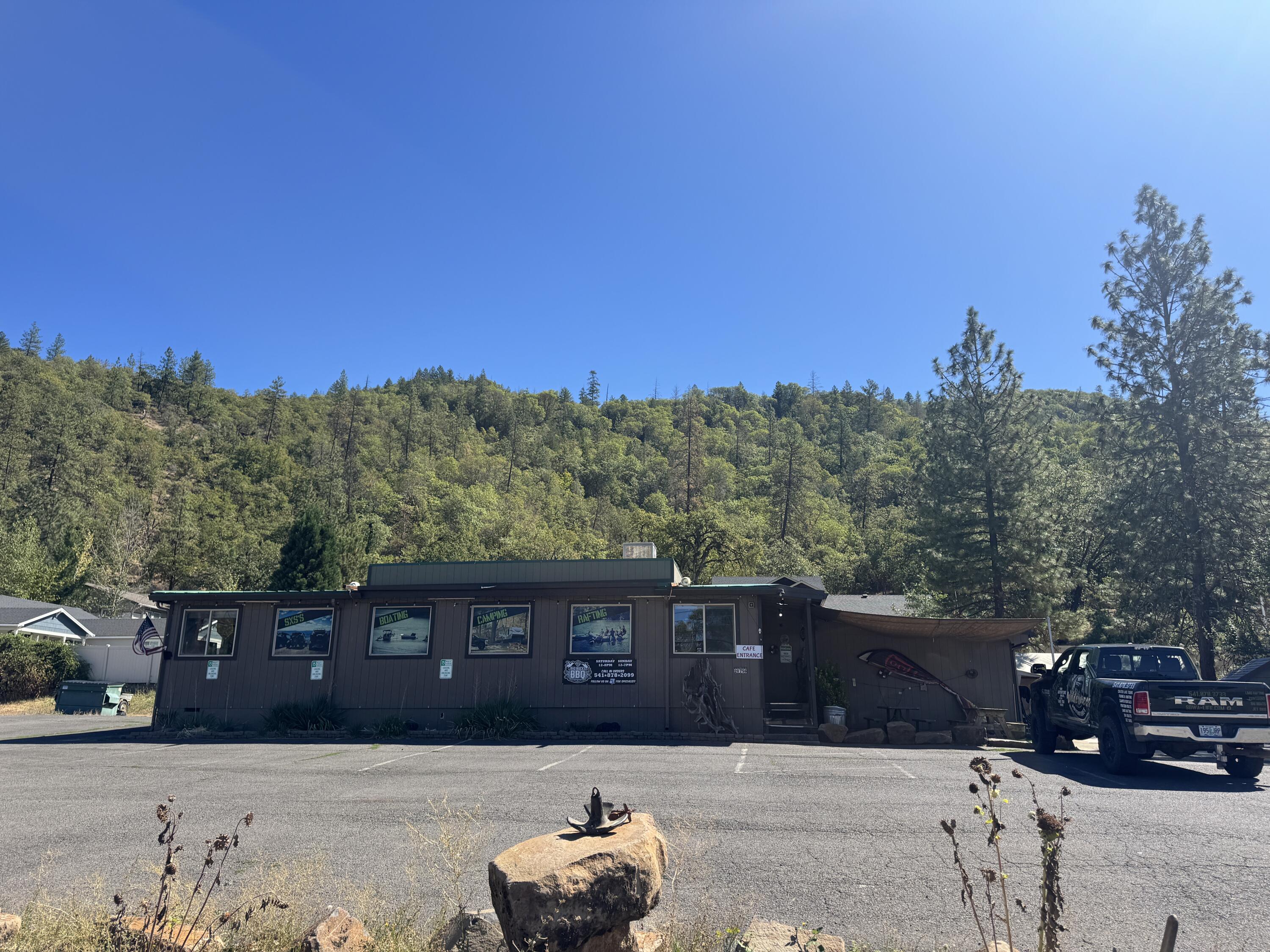Prime commercial opportunity in the heart of Shady Cove! Hard to find, this nearly 1,600 sq. ft. renovated building offers flexible office space, a fully equipped commercial kitchen, bathroom, and sits on a generous .83-acre lot with abundant parking. Located on a high-traffic stretch with excellent highway visibility, this property is ideal for a wide variety of ventures. Current approved uses include restaurant and outdoor recreation business, with GC zoning providing endless possibilities—check with the City of Shady Cove for additional options. Whether you're searching to establish a new business or expand an existing one, this property's location and layout make it a rare find. Appointment only. Priced to sell immediately—don't miss out on this excellent investment opportunity!