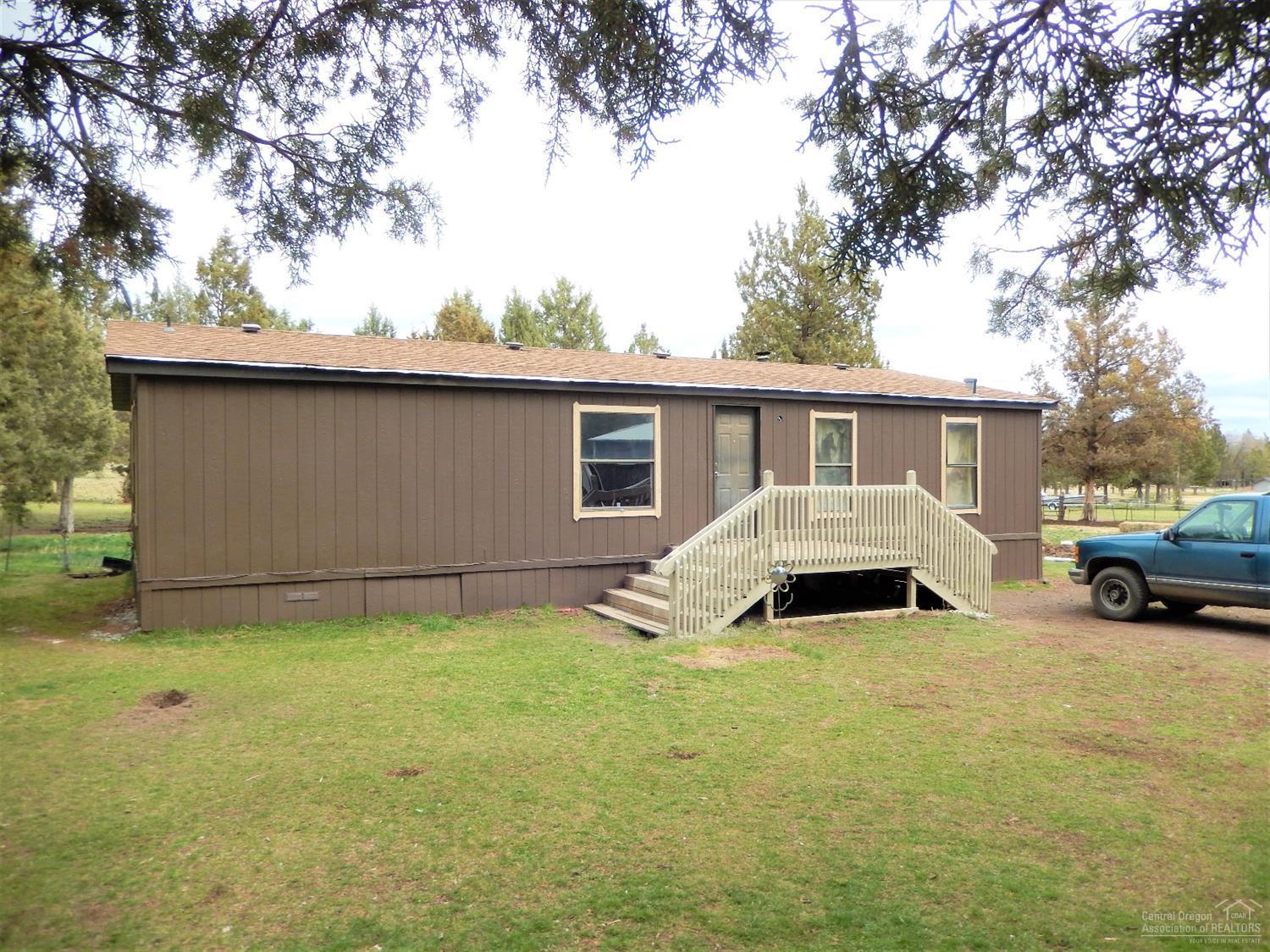 Double wide country home on nearly 5 acres! Large pole barn (30' x 60') is wired for 220 and features a large tack room. Fenced pastures, frost freeze water pumps and a round pen. Bring your horses!