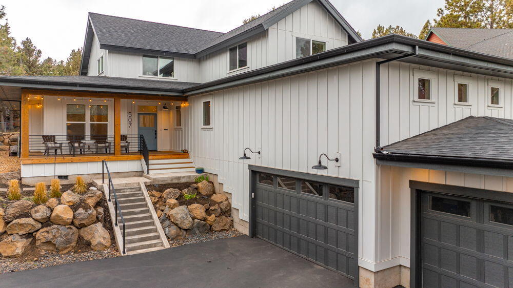 Walk into this stunning like new custom built home in NW Bend on a private tucked away lot.  This home features 4 bedrooms, 4 bathrooms, an office and a bonus room.  The main level has two primary suites, large open floor plan with a wet bar and beautiful gas fireplace.  It was custom built and finished in 2022 on a landscaped .36 acre lot.  There is a 3 car garage with large driveway. This is a must see!