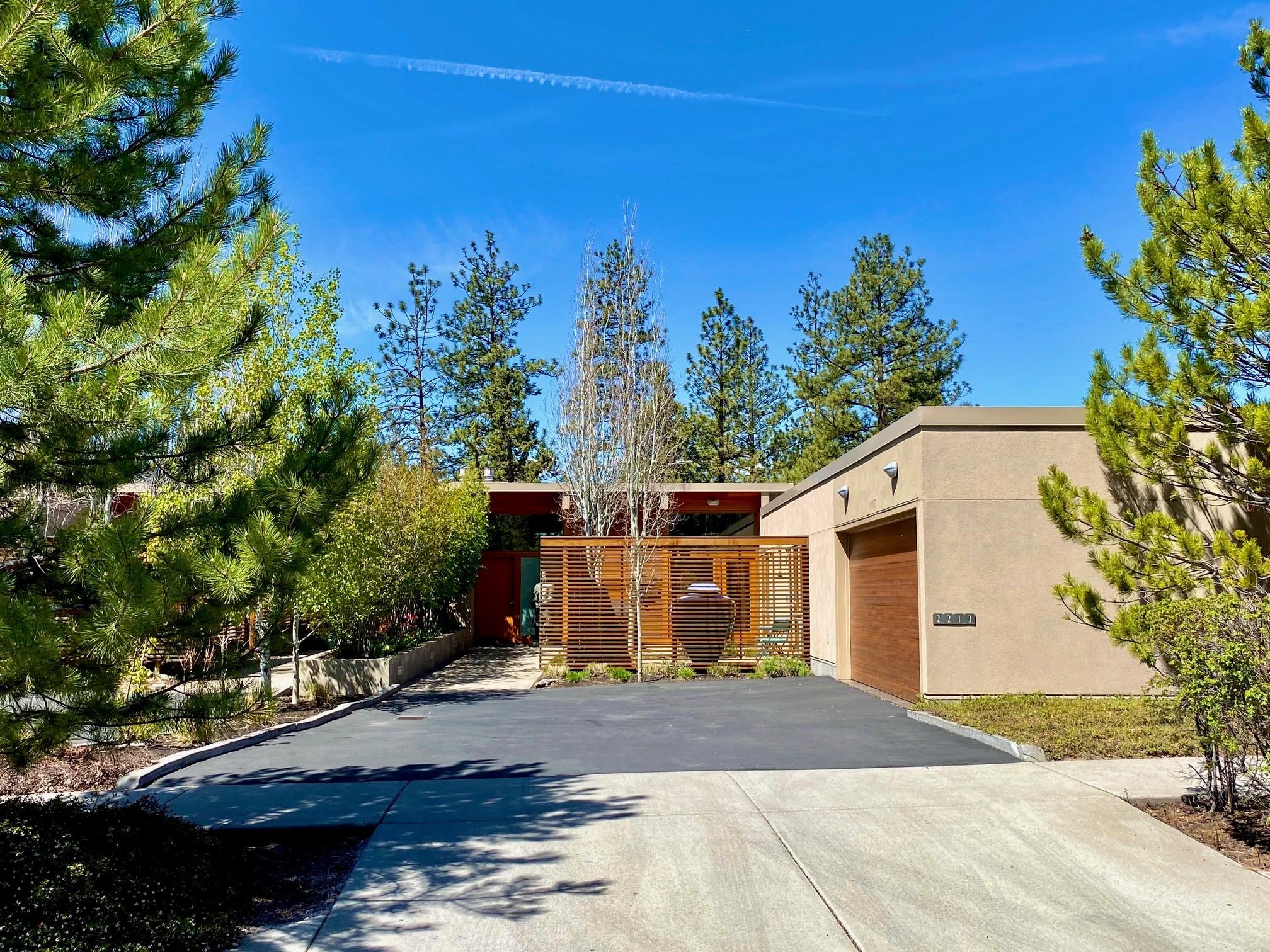 Retreat to your very own spectacular contemporary oasis in the highly sought after Shevlin Reserve offering Cascade Mountain views & a serene setting on a private 0.33 acre lot. Luxurious, modern open concept design seamlessly integrates indoor & outdoor living with a 23' wall of sliding windows via German engineering. Imagine relaxing on your patio next to the wood burning outdoor fireplace taking in the awe inspiring views of Broken Top & your private expansive backyard. This is truly an entertainer's delight. Chef's kitchen with Bosch & Thermador appliances, stainless steel counters, island with wine fridge & new cabinets. High-end finishes throughout: radiant heat floors, Carrara marble in all baths with heated floors in master bath. Airy, light filled master suite with large walk-through closet. Guest bedrooms have their
own wing & access to a central courtyard perfect for gathering. Just minutes to Discovery Park & Shevlin Park with hiking & biking right out your front door.