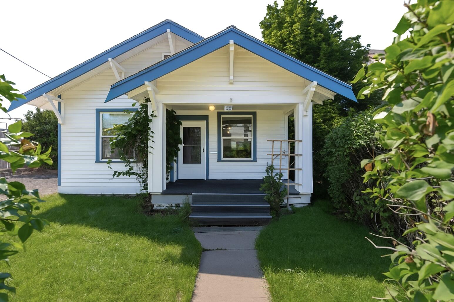 Incredible location for this west Bend home, offering a blend of historic charm and modern updates. Located just minutes from Drake Park, Jackson's Corner, and the Old Mill, it features updated flooring, custom built-ins throughout, and a roomy utility space with a kitchen nook. This home has a Jack and Jill bathroom with shower/tub combo, large bedrooms with real fir hardwood trim, and roomy closets. Enclosed patio/porch with new shades for added relaxation and enjoyment.

With convenient alley access, dedicated RV parking, and a detached garage that includes an upstairs room with extra storage, this property offers versatility for work, hobbies, or potential ADU conversion.

The expansive front and backyards, are shaded by mature trees, providing a perfect setting for gatherings or quiet evenings on the patio.