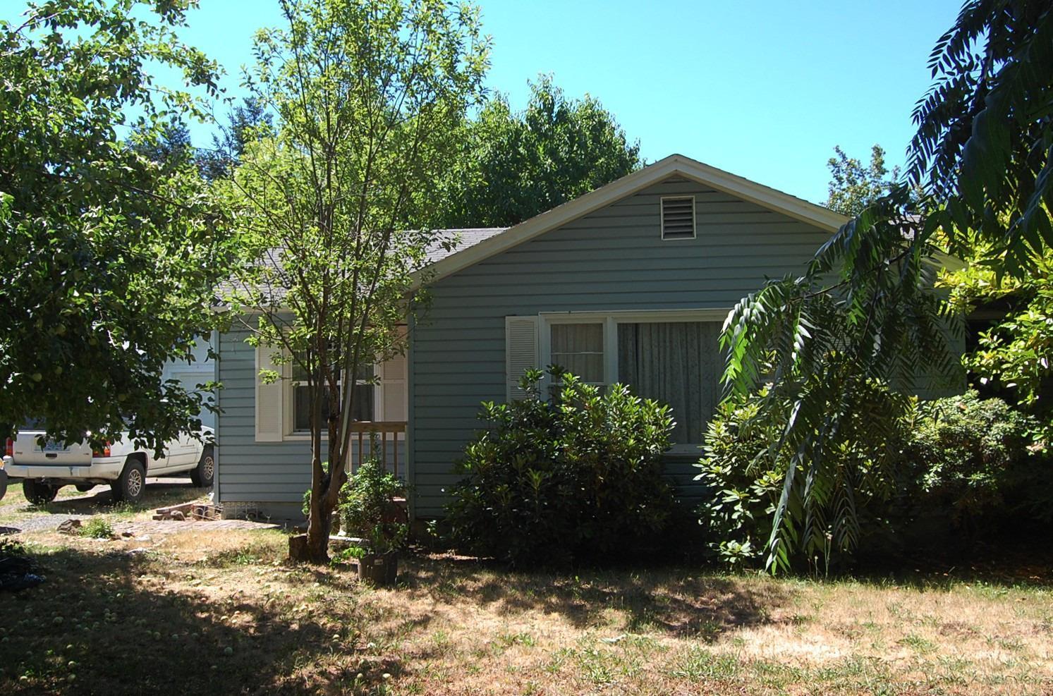 This wonderful 1950's home has had some upgrades....vinyl siding, heat pump system, newer duct work, flooring, updated bathrooms and more. The back yard is fenced and houses a storage shed and workshop. There is a single car detached garage... and a two car garage that was framed some time ago but never finished. Located close to the elementary school. Not far from shopping, doctors, and hospital.