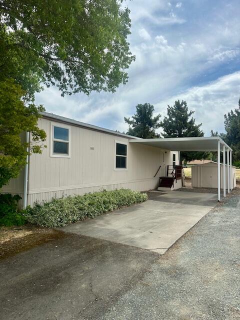 LOCATION!!! This manufactured home sits in the prime location at the end of the 55+ Blue Spruce Mobile Estates Park. Minutes from downtown Jacksonville. This 2 bedroom, 1 bath with 728 sq ft has been freshly updated inside with paint, carpets in the bedrooms and wood laminate floors in the living space. There is a large carport outside next to an open field that allows for views and quietness. Monthly dues are $575.00 covering irrigation, water and sewage. Appliances, washer and dryer are included. Vacant and move in ready.