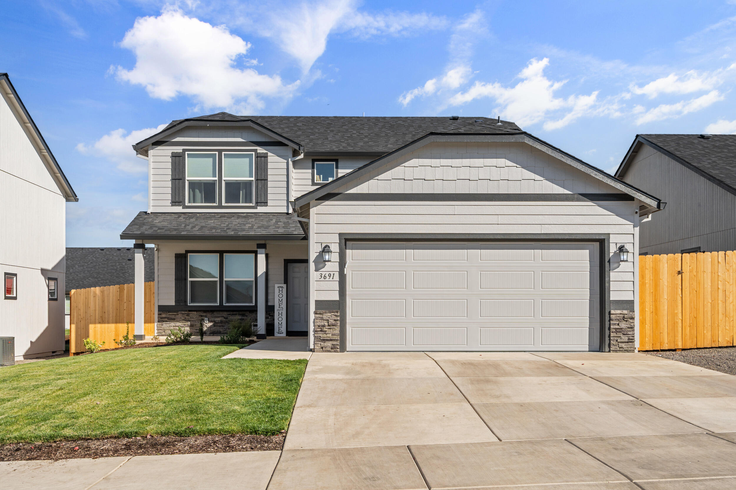 Beautifully designed and recently built, this 2,026 sq. ft. home sits in a safe, desirable Medford neighborhood close to schools and parks. The open concept main floor features a spacious kitchen with a large island and new fridge, while upstairs you'll find a luxurious main suite with an oversized closet, soaking tub, and dual vanity. The backyard is a true highlight, complete with new fencing, a new play structure for the kids, and plenty of room to enjoy outdoor living.