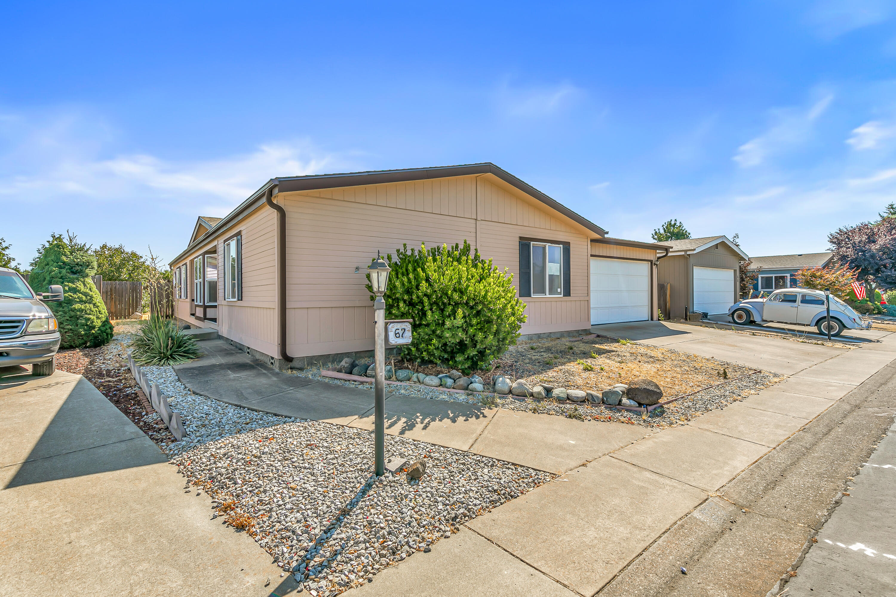 Enjoy a relaxed, low-maintenance lifestyle in the desirable Meadows 55+ Community in Central Point. Great opportunity to own your own home on land for under $250,000, and with low HOA dues of just $140/month,  which provides access to community amenities including a clubhouse, pool, and more.

With almost 1600 sq ft*, this well-designed home features 3 bedrooms and 2 full bathrooms, including a spacious primary suite with dual vanities, a walk-in shower, and a soaking tub.  The open, split floor plan offers two separate living areas, perfect for visiting guests or hobbies.

You'll also enjoy the peace of mind and convenience of an attached two-car garage.

Whether you're looking to downsize or simply enjoy a more carefree lifestyle, The Meadows is a wonderful place to call home. Come see for yourself!

*Per FHA Appraiser 1593 sq ft home and 4828 sq ft lot.  Per County Assessor 1620 sq ft home and 4792 sq ft lot.