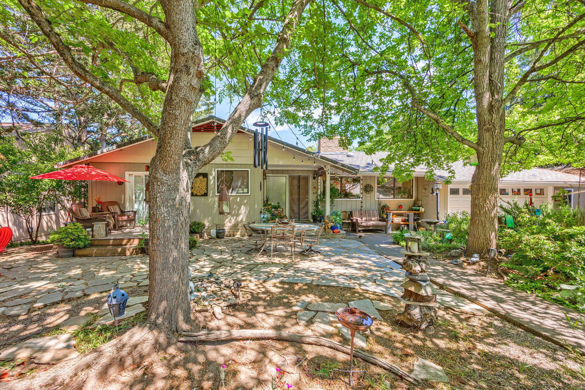 Spacious two family setup ready for new Owner!  Close in to downtown, above the blvd. and near Ashland Hospital on a quiet cul-de-sac, this amazing home awaits your finishing touches to make it perfect!  Flowing floor-plan upstairs,  sizeable kitchen and living room, fireplace(both up and down), beautiful sun room, lots of windows, roomy primary bedroom, 2nd and 3rd bedrooms, large garage are just some of the upstairs features that make this property special.  Downstairs presents with a living room, dining area, second kitchen and bath, and another good sized primary bedroom. Additionally there is a bonus room with a separate entrance that would make a great gym/office/craft room?  Patio off lower level is perfect for entertaining and bbq's, huge back yard, and generous, private front yard make this space something to see, Many mature trees provide shade and privacy.  Perfect two family setup on roomy lot in the heart of Ashland, Come and see for yourself.