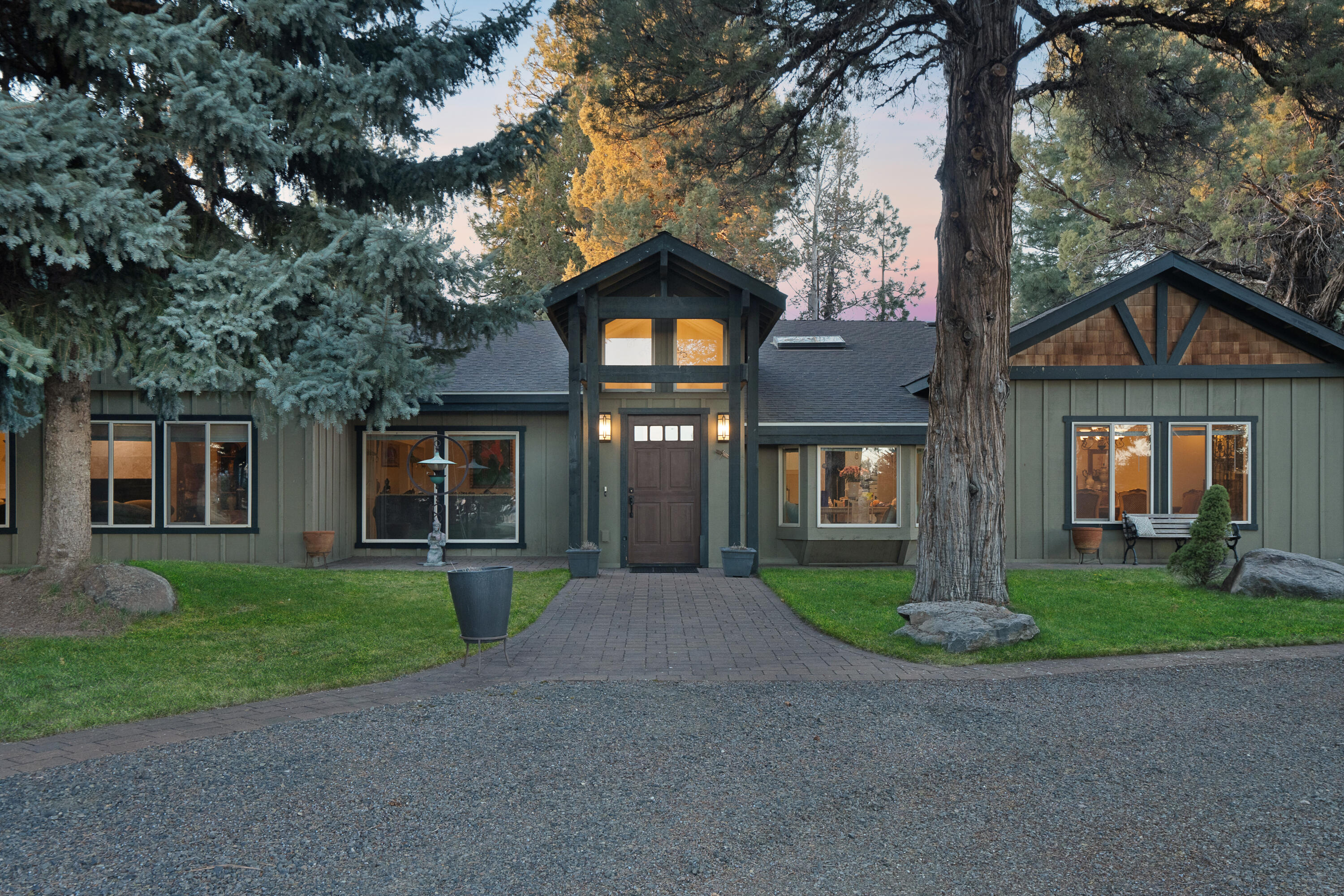 Indulge in the epitome of ranch living on this expansive 63-acre property, featuring a grand 4,797 square-foot main residence, a private guest home, a distinct apartment, and picturesque mountain vistas. Enjoy an array of opulent amenities amidst the tranquil beauty of the surroundings. The main home features multiple en-suite bedrooms and spacious outdoor areas, perfect for relaxation and entertainment. Explore landscaped paths leading to three tranquil ponds and enjoy panoramic vistas of the Three Sisters and Broken Top Mountains. This exceptional estate includes an 8-stall horse barn, garden, greenhouse, pet kennels, and a large workshop. With room for up to 14 cars and 4 RVs, it caters to car enthusiasts. Wildlife enthusiasts will delight in observing deer, elk, bald eagles, and more. Additionally, 56 acres of hay fields with 1895 senior water rights ensure ample irrigation. Water distribution is managed efficiently through a pressurized system.