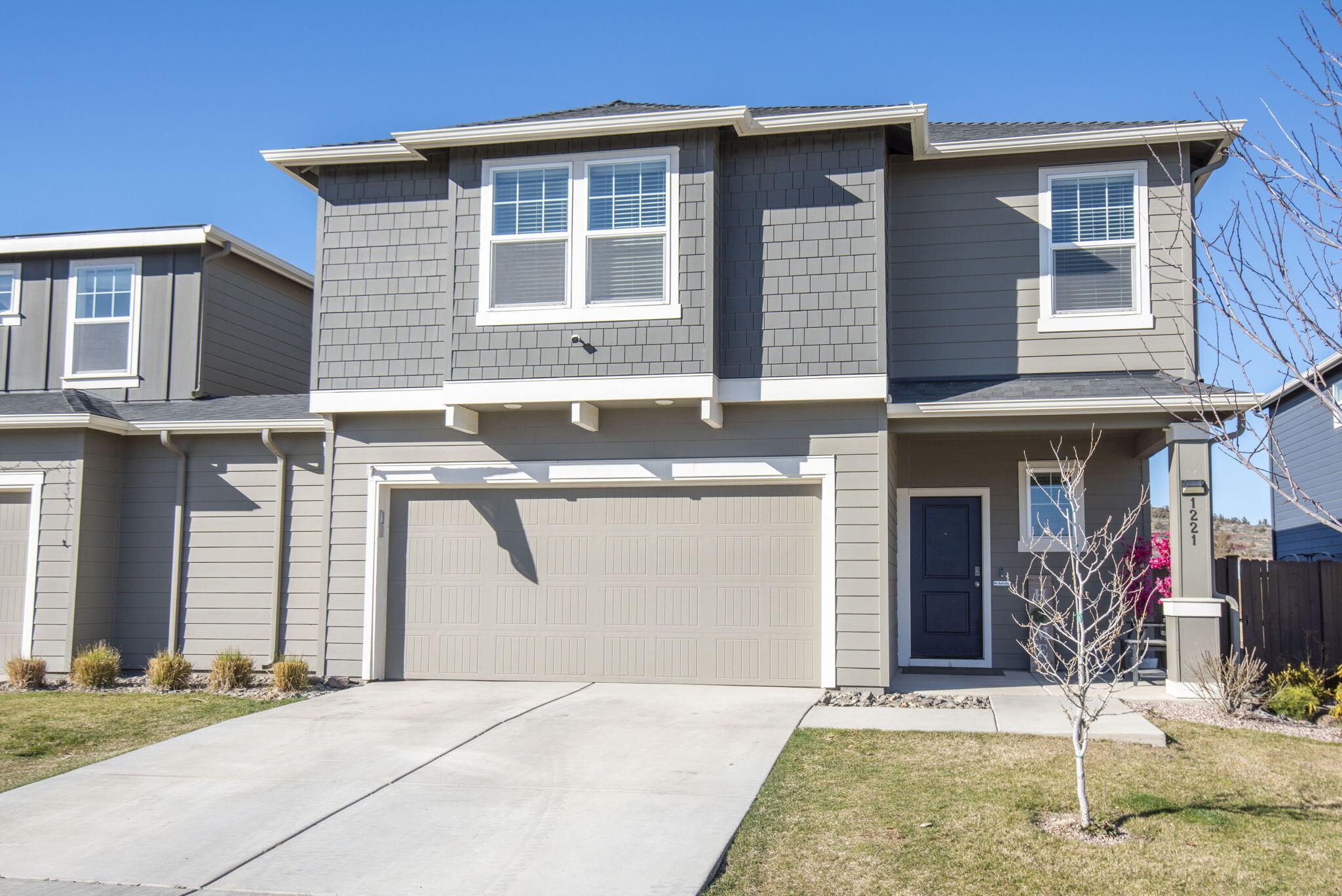 A 2.7% ASSUMABLE LOAN and a $7800 interior paint allowance make this home a winner! This is living at its best. The HOA takes care of the front lawn and the exterior paint and roof, so you can simply enjoy the huge 40' x 85' entertainer's dream yard with two large pergolas that have electrical and TV hookups. This well-maintained home is conveniently located one block from Tom McCall Elementary and has easy access to Hwy 97. The inside is spacious with tall ceilings, lots of space, a large flex room and a beautiful open kitchen that looks out to your backyard.,  Quartz countertops, gas range, white cabinets, and SS appliances are a few of the features you will enjoy. Lives like a single family home with just a small garage wall that connects neighboring unit.  This property is a must see and offers so much more than you would expect.. Make your appointment to see it today!