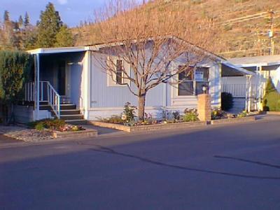Great home in Leisure Days 55+ park! Nice one owner Redman manufactured home, built in 1990. Very lite and brite living area. Nice kitchen with all appliances included. Washer and dryer too. 3 bedrooms, split floor plan. Double door master bath with garden tub, shower too. Lots of storage. Nice deck, lots of storage with additinal shed. Great location, close to the Rogeue River. Space rent is $328.00 per month.