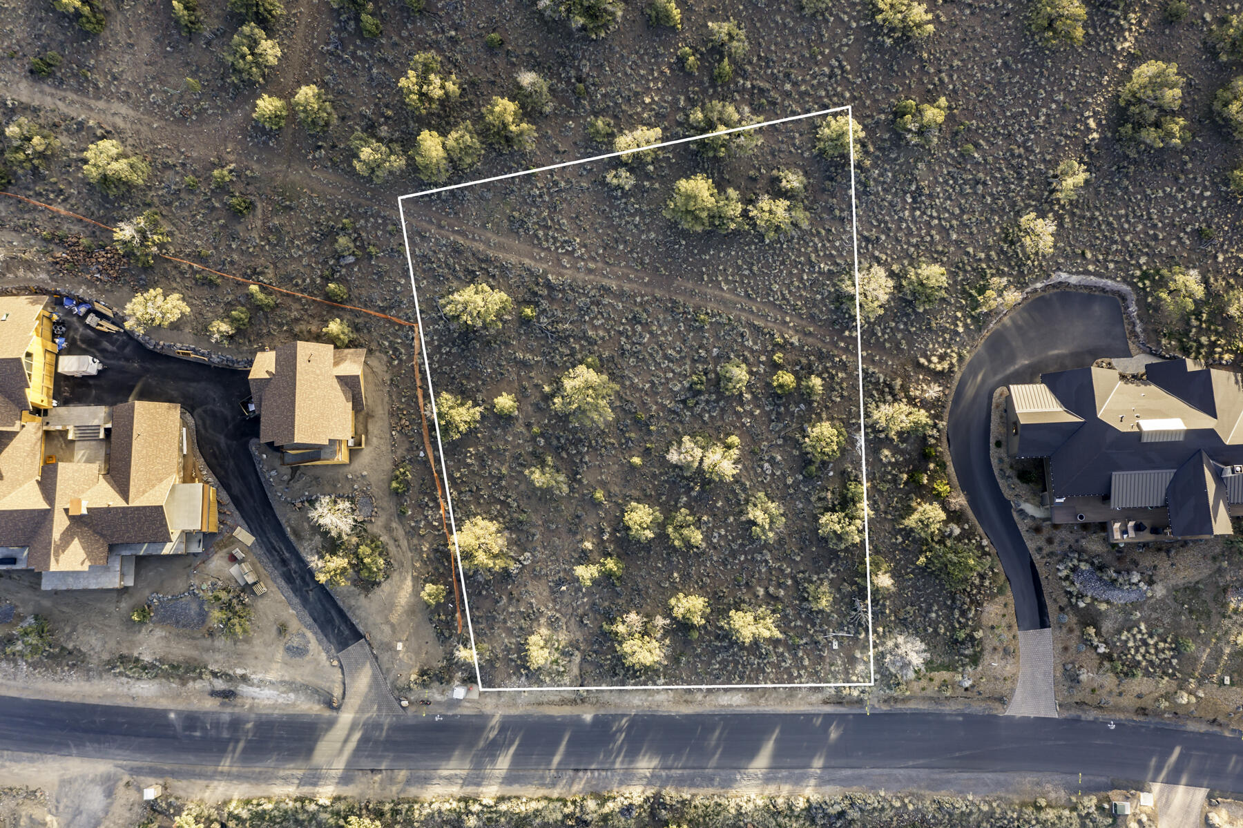Immerse yourself in the tranquility and exclusivity of Brasada Ranch Resort with this exceptional homesite. Boasting captivating mountain views to the west, this homesite offers unparalleled privacy as it backs onto undeveloped public lands, ensuring a serene and undisturbed future. As a Brasada Ranch member, you'll enjoy access to a world-class array of amenities, including an athletic center with multiple pools, a lazy river, and an equestrian center. Indulge in the pleasures of golf on the championship course designed by Peter Jacobson and Jim Hardy, or embrace the outdoors with hiking, biking, horseback riding, and fishing. This lot presents an extraordinary opportunity to create your dream home or vacation rental in the beauty of a renowned Central Oregon resort.