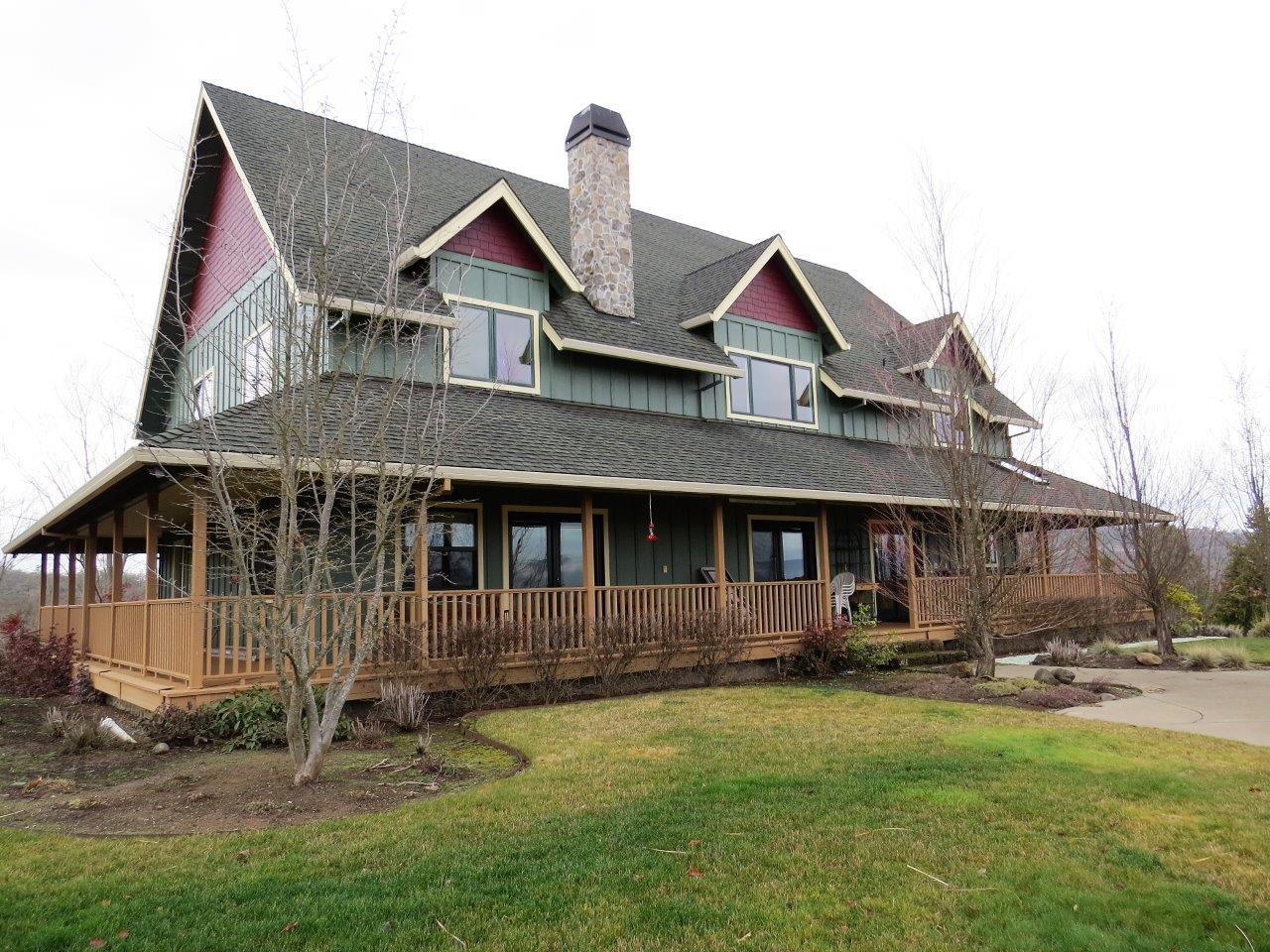 Are you looking for an incredible home along with a horse property that has a positive cash flow?? Here is a custom built home with 4056 sqft. Right off of the master suite you can enjoy the valley views from the covered porch! Excellent use of space that can offer extended living for guests or family. Gourmet Kitchen that is open to the living area and a bonus room for that needed space. This home even has a generator system for backup safety. The ranch offers all a horse enthusiast could imagine. Covered arena, outdoor arena, barns, trail course and plenty of trail riding. The ranch is currently a boarding facility that is so popular there is a waiting list! Plenty of pastures and even tack lockers. 123.27 acres with 80 in irrigation. Hay production was over 4500 bales last year! 2nd home on the property, great well. Ranch equipment and furniture in the main home can be purchased separately to make this turnkey and ready to make your own.