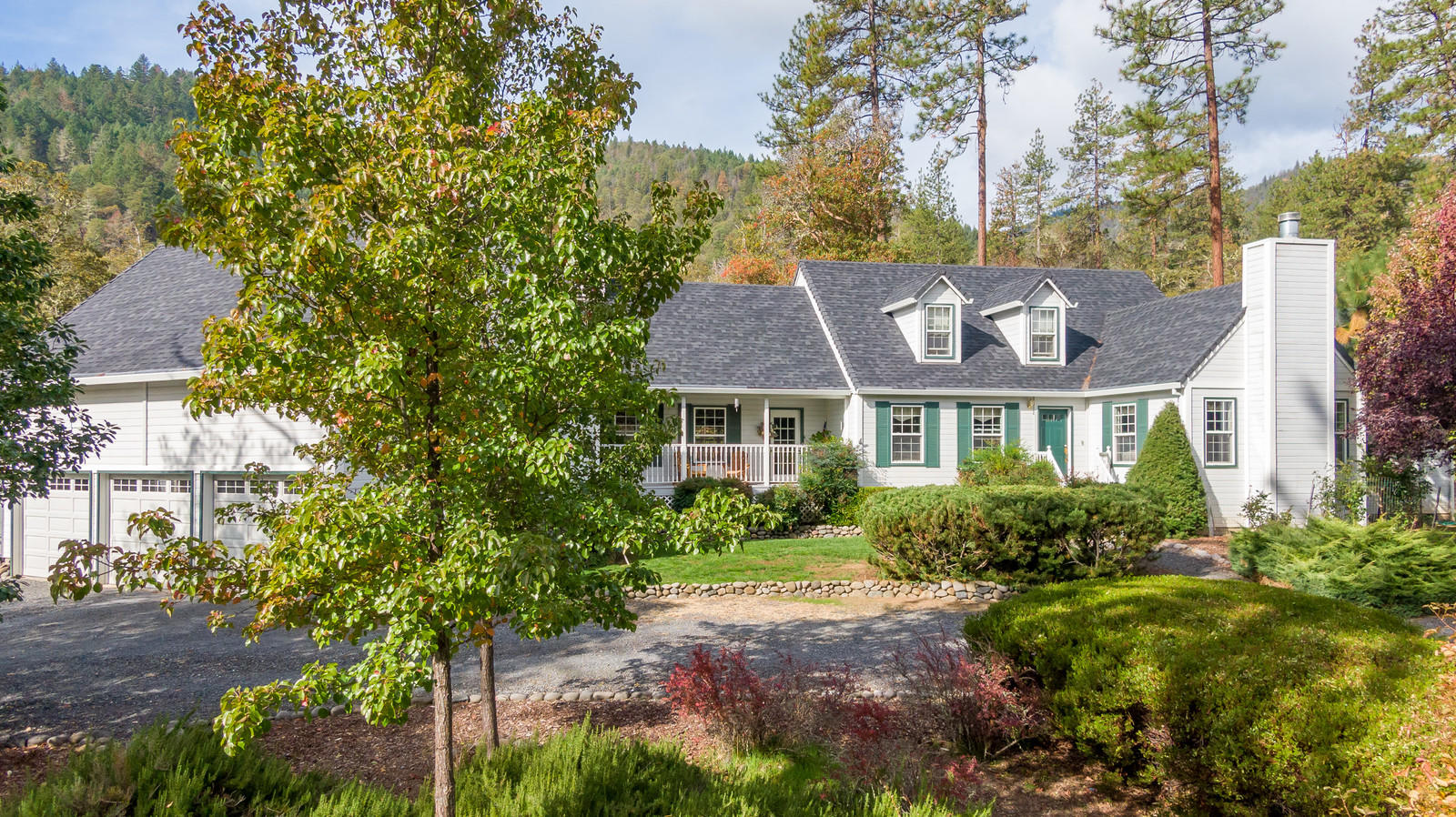 Welcoming Cape Cod style home nestled in the trees on 6.82 EFU acres w/ grandfathered irrigation rights & river frontage on the lower portion of the property. Featuring approximately 5 acres of fenced/cross fenced pasture, a professionally engineered 36x36 metal 3 stall barn, w/ tack room & hay storage. This is a great horse property that backs to BLM land w/ direct trail access. Updates in 2016 include a new roof, refinished hardwood floors & updated appliances. Inviting main level master w/ vaulted ceilings, walk in closet, jetted soaking tub & double sinks. There is also a formal dining room, sitting room & large family room on the main level. Both family & sitting rooms feature wood burning fireplaces. The spacious kitchen has a large island & lots of storage. Office on main level could be converted into another bedroom if needed. Upstairs features 2 large bedrooms w/ full bath. Don't forget the large laundry room & the oversized 3 car garage. Impeccably maintained home!