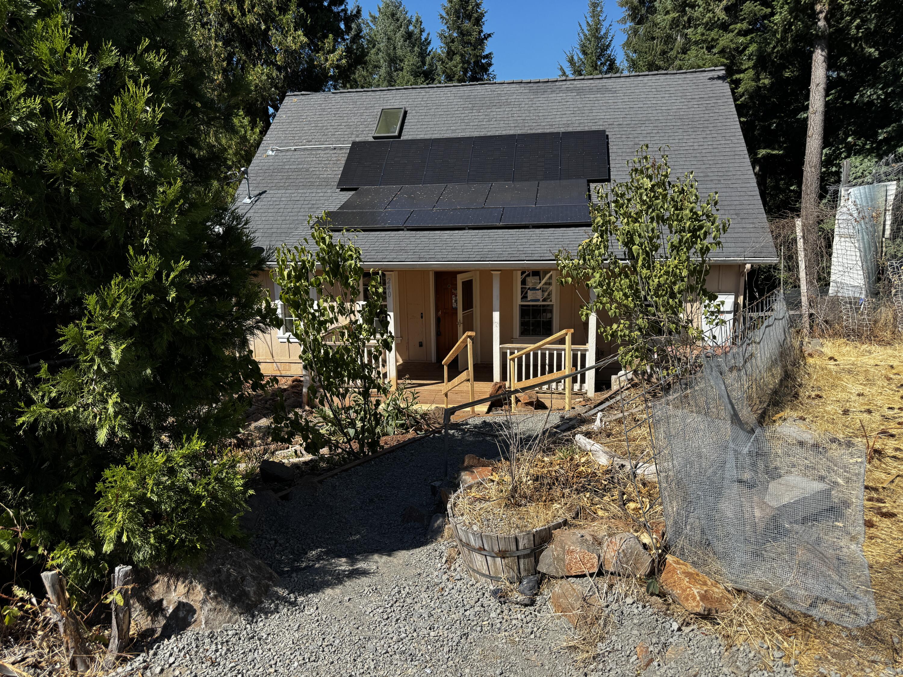 Discover this 3-bedroom, 2-bath home with 1,481 sq. ft. of comfortable living in the quiet town of Butte Falls. Inside, hardwood floors, vaulted ceilings, and an open floor plan create a warm and welcoming atmosphere. The propane fireplace adds a cozy touch, while the spacious kitchen and living areas make entertaining easy. A Generac backup system and solar panels provide peace of mind and energy efficiency. Step outside to a covered deck with serene views—no neighbors directly behind for added privacy. A perfect blend of modern convenience and small-town charm, this home offers the lifestyle you've been waiting for.