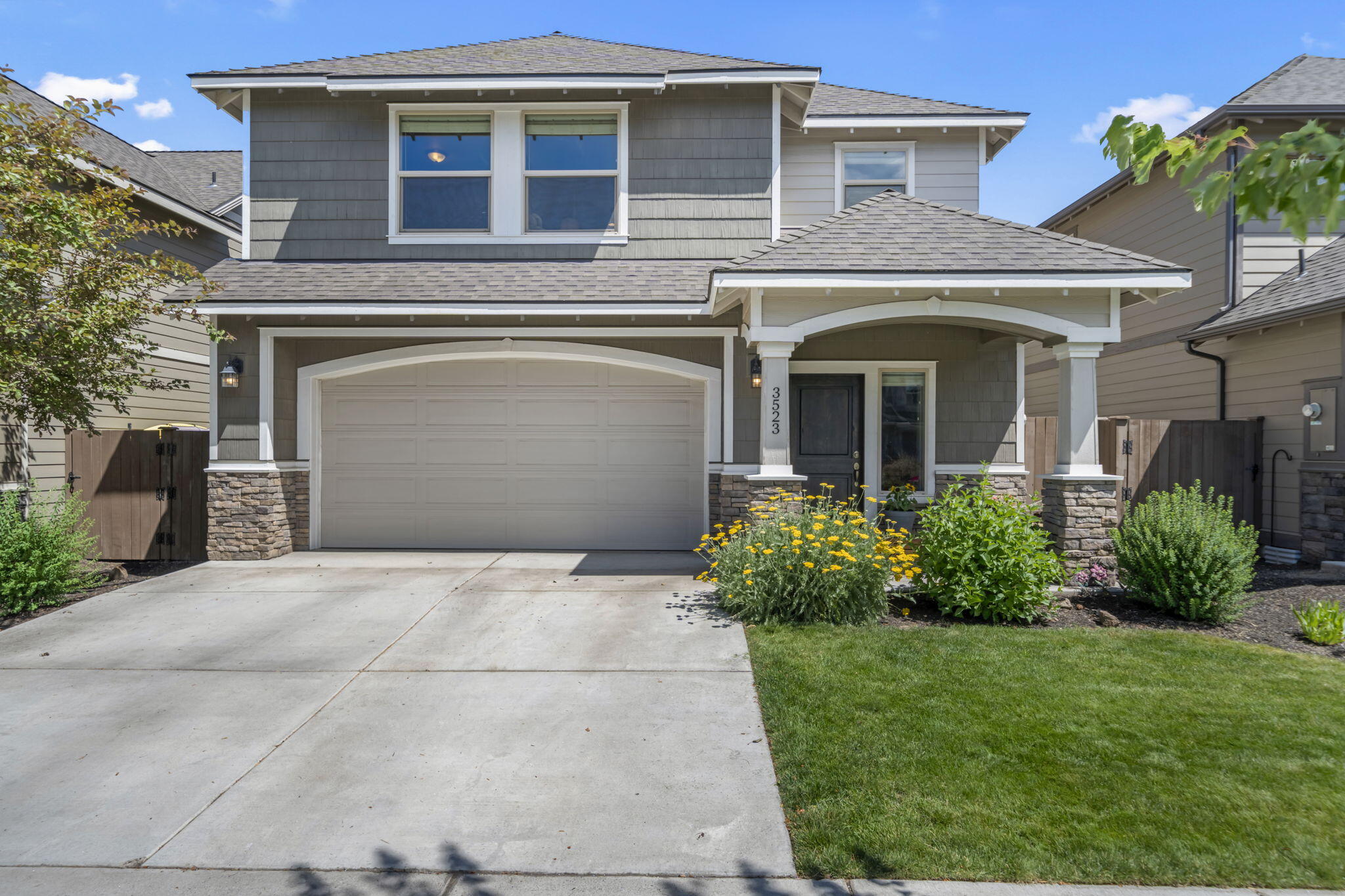 Located in NE Bend's desirable Mirada neighborhood, this Franklin Brothers home offers access to Eagle Park, a community pool, and front yard landscape - perfect for active, connected living. The thoughtful floor plan features 4 bedrooms, 2.5 baths, and a vaulted ceiling primary suite. A spacious great room centers around a cozy gas fireplace with stone surround and hearth, while the kitchen features quartz counters and stainless steel appliances. The laundry room includes a utility sink and extra storage. Outside, enjoy the extended paver patio with built-in fire pit and a custom greenhouse or play shed, ideal for gardening or imaginative play. Close to schools, restaurants, and shopping.