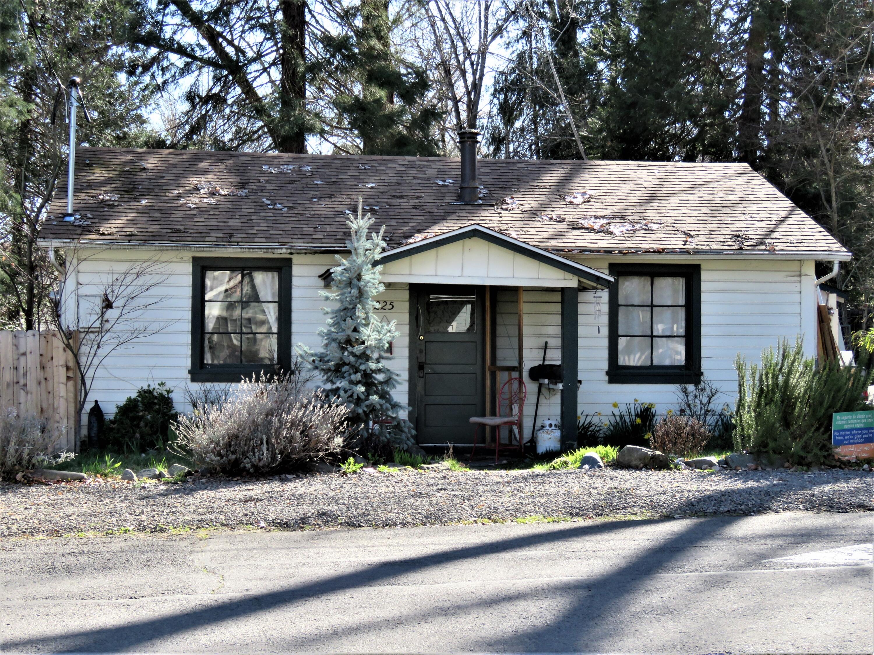 Located in the heart of Jacksonville's Historic District ... this cute cottage is a rare find.  Comfortable and cozy this 2 bedroom / 1 bath home is situated on a large .21 lot (a rarity now days) and is big enough to store an R.V. have a family picnic or just enjoy a bit of elbow room.  Close to local shopping, a grocery store, school and within a short scenic hike to the beautiful Britt Gardens (with its renown yearly music festival).  This property is ripe with possibilities. Come see for yourself why~ call for a tour today!