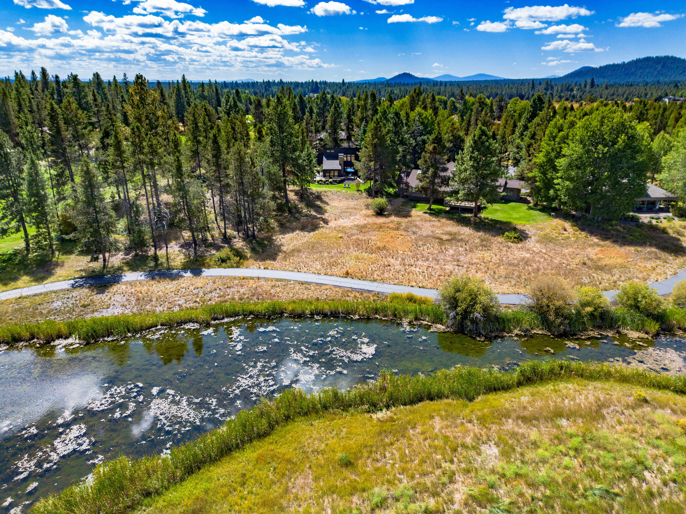 The one you've been waiting for - Sunriver at its very best offering incredible privacy, sweeping views, meticulous updates and timeless architecture. Completely renovated inside and out, no detail has been left behind. Boasting ground floor Primary and Jr. suites, large picture windows, a chef's quality kitchen, wrap-around composite decking, an upstairs family room, 3rd bedroom and 4th ''guest room,'' 13 Vista Lane offers something for everyone. Enjoy expansive views out across the Great Meadow, the Sun River & golf course fairways while you dine outdoors on the generously sized deck, then end the day gazing upon the stars from the hot tub. 
Located on Sunriver's desirable south end, Vista Lane offers an oasis surrounded by the Meadows Golf Course fairways, a leisurely walk or bike from Sunriver's Great Hall and Harper's Bridge over the Deschutes River - enjoy endless recreational opportunities right at your doorstep. 
Welcome Home.