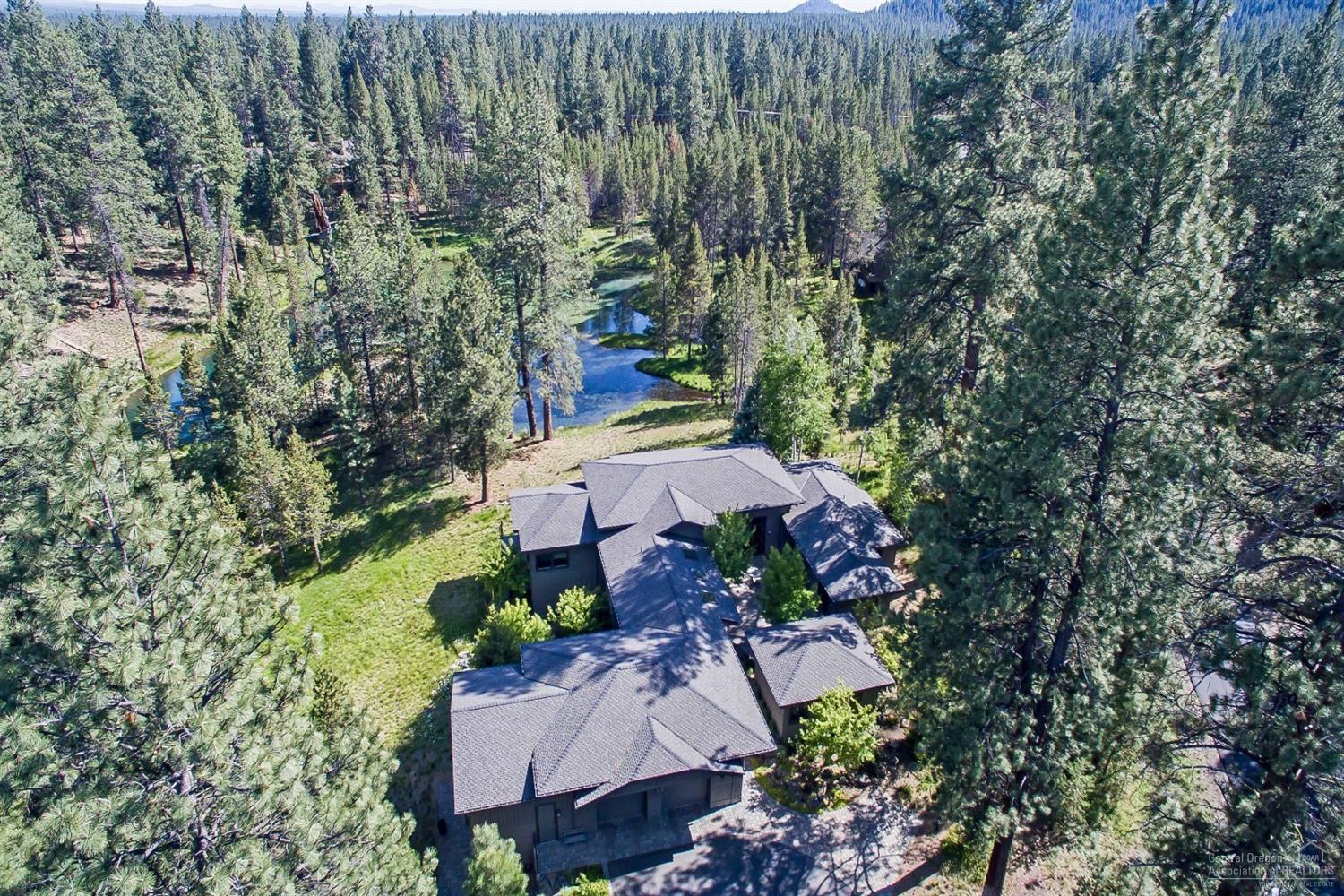 Awe-inspiring location at the edge of a natural, spring fed lake creates an absolutely stunning setting-the perfect back drop for an extraordinary lifestyle! Surrounded by water & wildlife, you'll enjoy gorgeous views from every room. Architecturally designed, custom built home enjoys single level living with a natural indoor/outdoor connection of living spaces. Private courtyard with Casita, woodworker's dream shop, radiant Geothermal heating/cooling system, plus many custom touches throughout.