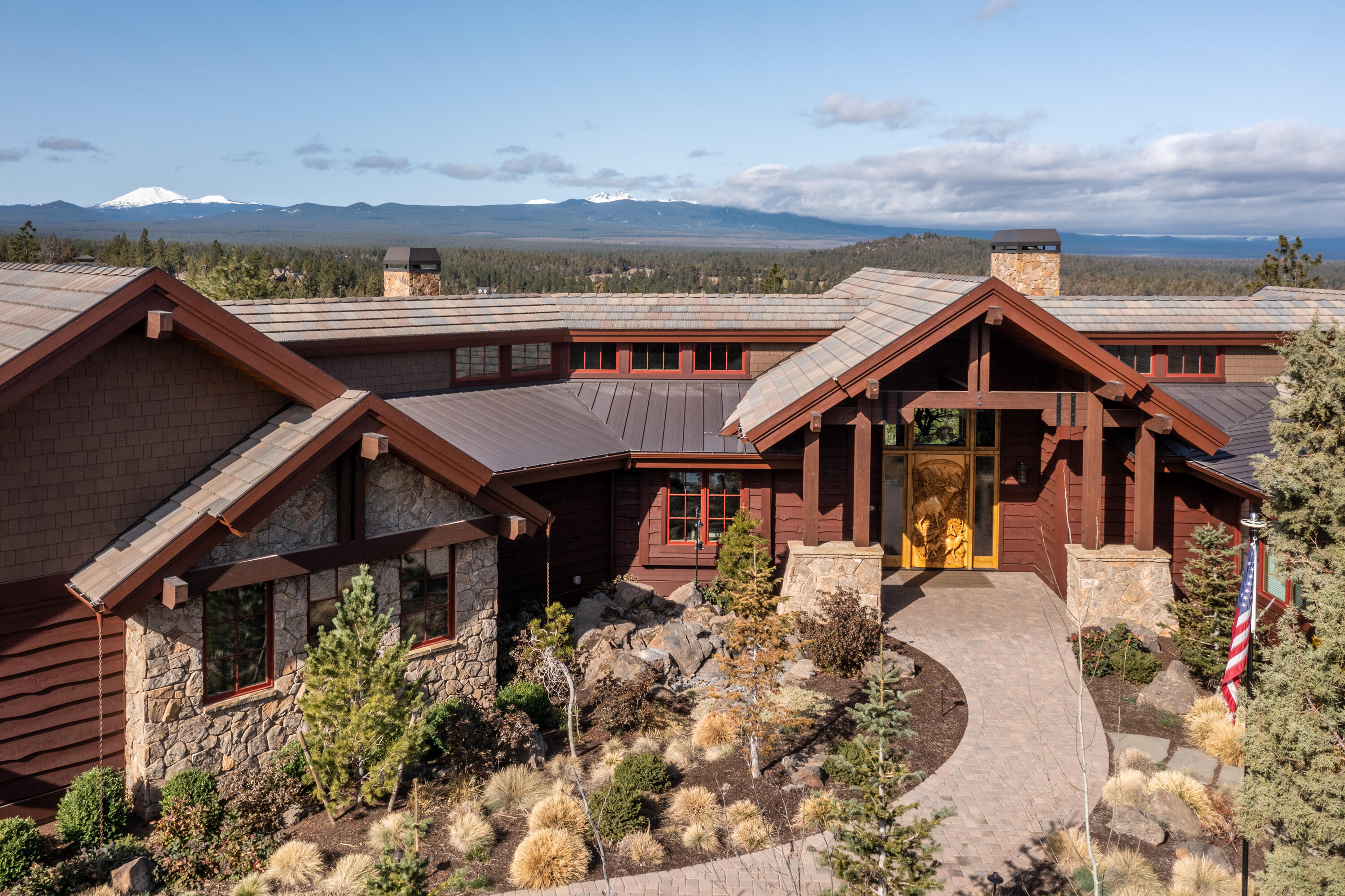 With the breathtaking Three Sisters Peaks, Mt Bachelor & Mt Jefferson, North Rim is the crown jewel of Bend's west side. This amazing custom home, perfectly positioned on one acre, lives all on one level. And it has a 6-car garage for all of your Central Oregon toys and gear! You enter the Great Room featuring a massive stone fireplace and outstanding views, exposed beams & wood ceilings. A home built for entertaining family and friends, with an open professional kitchen, ultimate wet bar, indoor/outdoor room with retractable doors, and a blazing fireplace. Wide plank White Oak floors throughout, a state-of-the-art Theatre Room, Office, Wine Cellar, Dual Primary Suite Baths & Closets. Complete with the North Rim Lodge, Tennis/Pickle Ball court & trail system. This home is a must see!