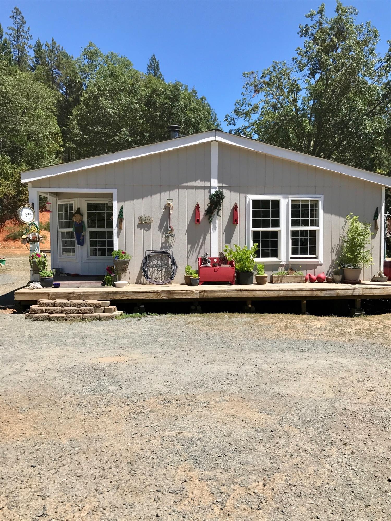 Build your dream home in the Mountains and have a home to live in while you do. Pad cut in with Private Mountain Views. Well, Septic, and Power ready to go. 9+acres and good well (according to owner). Place to ride your horse and keep your chickens. This property has your vision waiting.