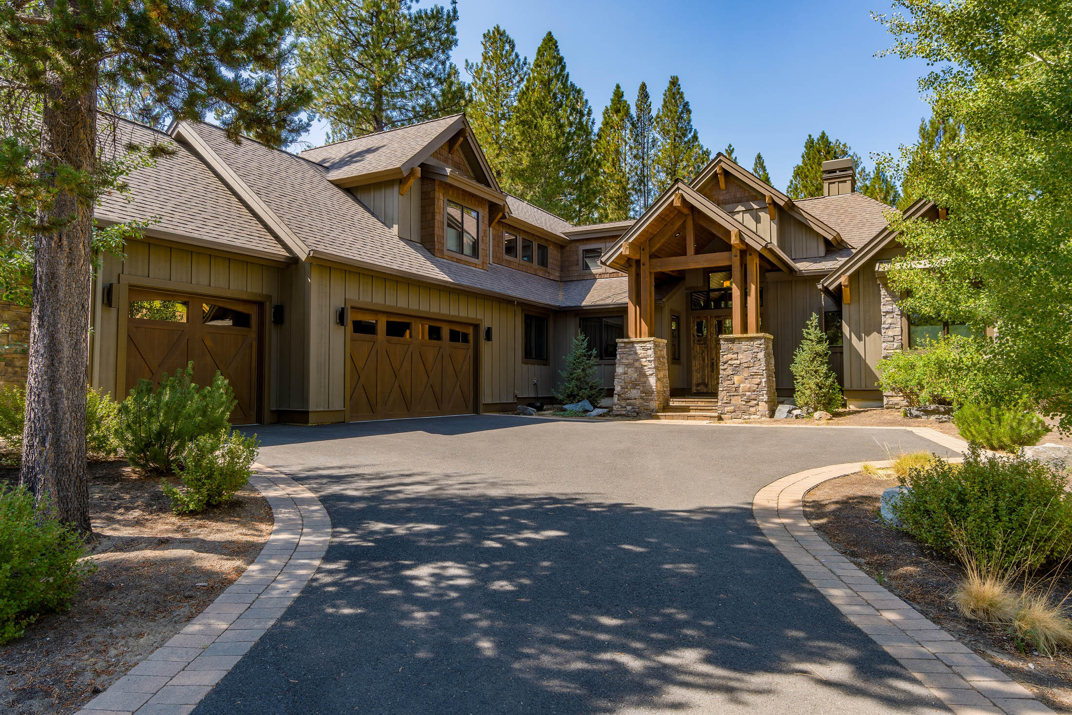 Custom Pineriver Homes built residence w/ Fireglass Lake views in Caldera Springs! Open floor plan includes a gourmet kitchen w/ chiseled edge granite and built in sub-zero refrigerator/freezer. Vaulted tongue & groove wood ceilings in the great room and floor to ceiling stone/gas fireplace w/ built ins. Spacious mud/laundry room leads to a 3-car garage w/ epoxy floors. 3 suites on the main level plus an office w/ wine storage. Upstairs you will find the 4th suite plus an additional bonus/bunk room w/ full bath. Wonderful outdoor space includes paver patio, sunken hot tub, gas fire pit and views of the lake. 3-zoned heating, wood windows, hardwood floors and much more. Start making memories in this Caldera Springs home!
