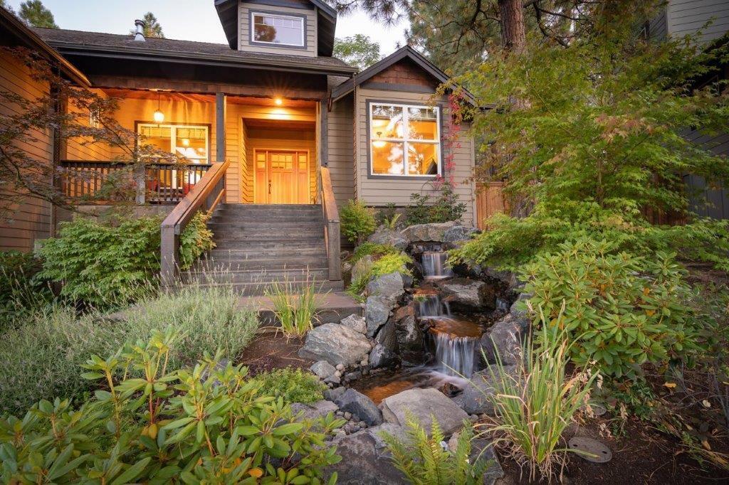 Northwest Bend home nestled in the trees bordering Quail Park with access from the backyard.  Enjoy this .25 acre quiet setting in a cul-de-sac.  Sellers have invested over $120,000 in landscaping to include water features front and back, a paver patio w/gas fire pit, landscape lighting w/timer and new fencing.  Main level includes primary bedroom suite, office, laundry, powder room and a huge 24x24 bonus room with a wood burning stove!  Cozy living room with vaulted ceiling, custom gas fireplace and fine art lighting.  Wide planked solid hardwood floor throughout the main level.  Kitchen has custom cabinets, slab granite counters, Stainless steel appliances and an eating bar.  Primary bedroom suite includes walk-in closet w/built-ins, soaking tub, walk-in tile shower, granite counter, dual vanities and tile floor.  Upstairs includes 2 bedrooms, full bath and large storage closet.  Forced air gas heat and AC. Tons of storage under the house! Close to Shevlin Park and trails.