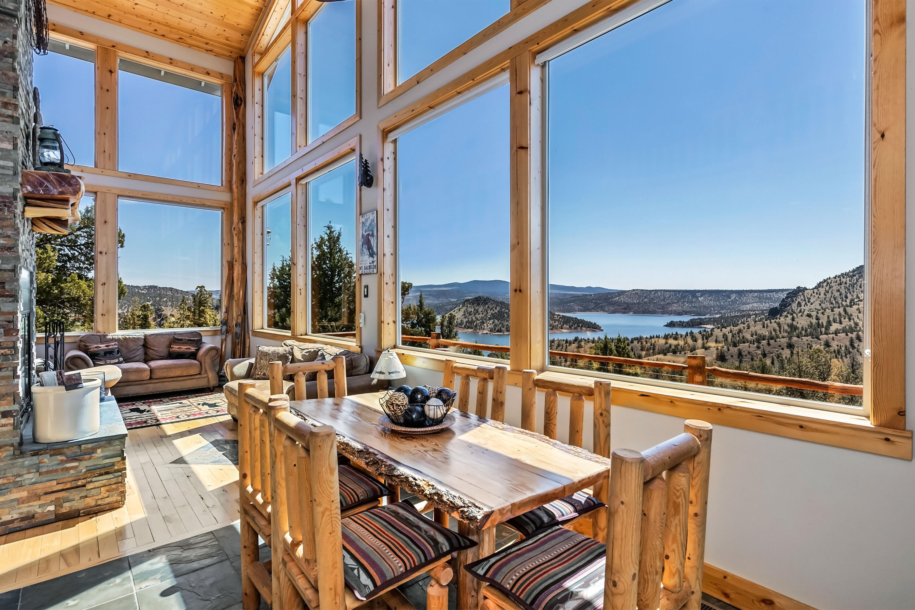 Short Term Rental Possibilities! Custom Home overlooking Prineville Reservoir! Views, views, views from the large open deck overlooking the lake and beyond. Excellent opportunity for multi-generational living, executive, shared second home, family gathering hub. Fantastic floor plan with two bedrooms on the main level, full bath,  kitchen w/custom hickory cabinets, dramatic great room wood burning fireplace and 2 story tongue and groove knotty pine ceilings, all designed to capture magnificent views. Upstairs features a large loft with views custom juniper railing, bedroom, full bath and star gazing deck. Lower-level features bonus room, laundry room, family room and walk-in crawlspace that could be the perfect wine cellar. Fully wrapped windows and doors throughout, ceiling fans throughout, all bedrooms with walk-in closets! Attached 2 car garage at its main level. Large lot with fire pit and wrap around deck. Property joins public lands, minutes to boat ramp.