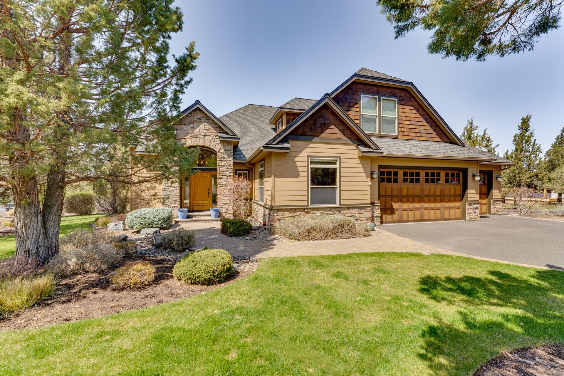 Turnkey, Fully Furnished w/ High End Furnishings, a stunning ''Ridge at Eagle Crest'' Home!  Immaculate 3 bed, 3.5 bath home w/ Updates in 2021. Stone Fireplace, Granite Counters & Hickory Hardwood Floors will greet you upon entry.  Corner .45 Acre Lot.  Primary Bedroom on Main w/ Bath, Heated Floor, Tile Shower, Jetted Tub, Dual Vanities & Walk-in Closet. Main Floor includes Second Bedroom w/ Bath, Large Office w/ Closet (4th Bedroom) , Powder Room & Laundry.  Open Floor Plan w/ Kitchen, Living & Dining Area & Custom-Built Wet Bar. Kitchen Island provides Seating for 6. Large Bonus Room & 3rd Bedroom & Bath Upstairs. Tiered Deck w/ Hot Tub. Custom Wet Bar w/ Black Walnut Live Edge Bar top, Waterfall Edge Barback & Backsplash Carved & Backlit, 3 Commercial Wine Coolers & Double Door Beverage Cooler, 55'' Wall Mounted TV. Fresh Interior Paint & New Carpet throughout. 3rd Garage Bay w/ Wall Mount TV & Heat can be locked off. TVs & Sound Systems included