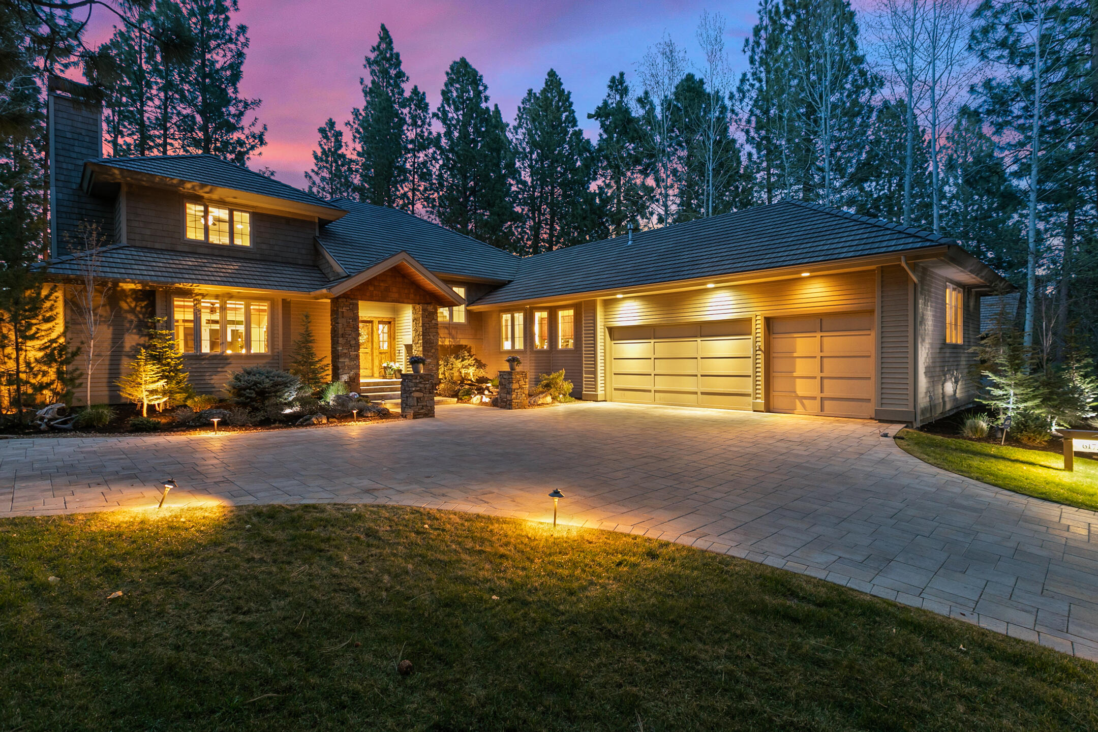 Enjoy luxurious casual living in this gorgeous Broken Top golf course view home.  Welcoming foyer leads to sunny & bright great room with floor-to-ceiling stacked rock wall surrounding the fireplace, box beamed ceilings & expansive windows that flood the interiors with natural light & frame the golf course views that lie beyond lushly landscaped yard. Dining room is ideally positioned for entertaining or quiet meals at home, prepared in gourmet kitchen featuring glazed cabinetry, Wolfe range, breakfast bar, wine refrigerator & solid surface counters. Tranquil main level owner's suite has been expanded to create a sitting area from which to enjoy fairway views & quiet time in front of cozy fireplace. There is also a private & spacious en-suite guest room on main level.  Upstairs family room & balcony provide amazing golf course views, as do two additional guest-suites providing perfect retreat for family & guests. Expansive paver patio for enjoying peaceful setting & golf course views.