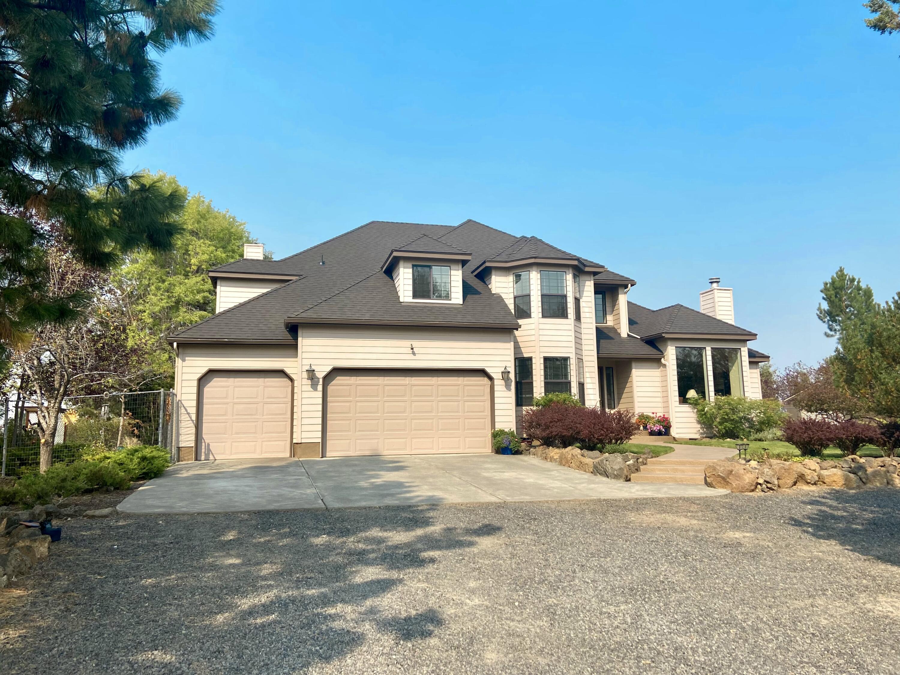 The Cascade Mountain view of your dreams awaits at this close-in 4.76 acre property! Grand entry welcomes you into the formal living and dining rooms where views are sure to please! Huge kitchen overlooks the back deck and mountains, and opens to the large great room. Also downstairs is an office or artist studio with great windows and lots of light. Upstairs you'll find a grand primary suite with even MORE mountain views! Huge ensuite bath and walk-in closet. Pull down stairway in closet leads to usable bonus attic space. A junior suite, 2 more bedrooms and hall bath complete the upstairs space. Outside you'll find both a storage shed and 14'x24' shop with workbench and storage plus roll up door. If you're lucky, the neighborhood owl might fly out of the trees as you walk through the grounds! This home has been lovingly maintained and is ready for new owners - brand new roof, back deck freshly refinished, inspection and minor repairs completed, move-in ready.